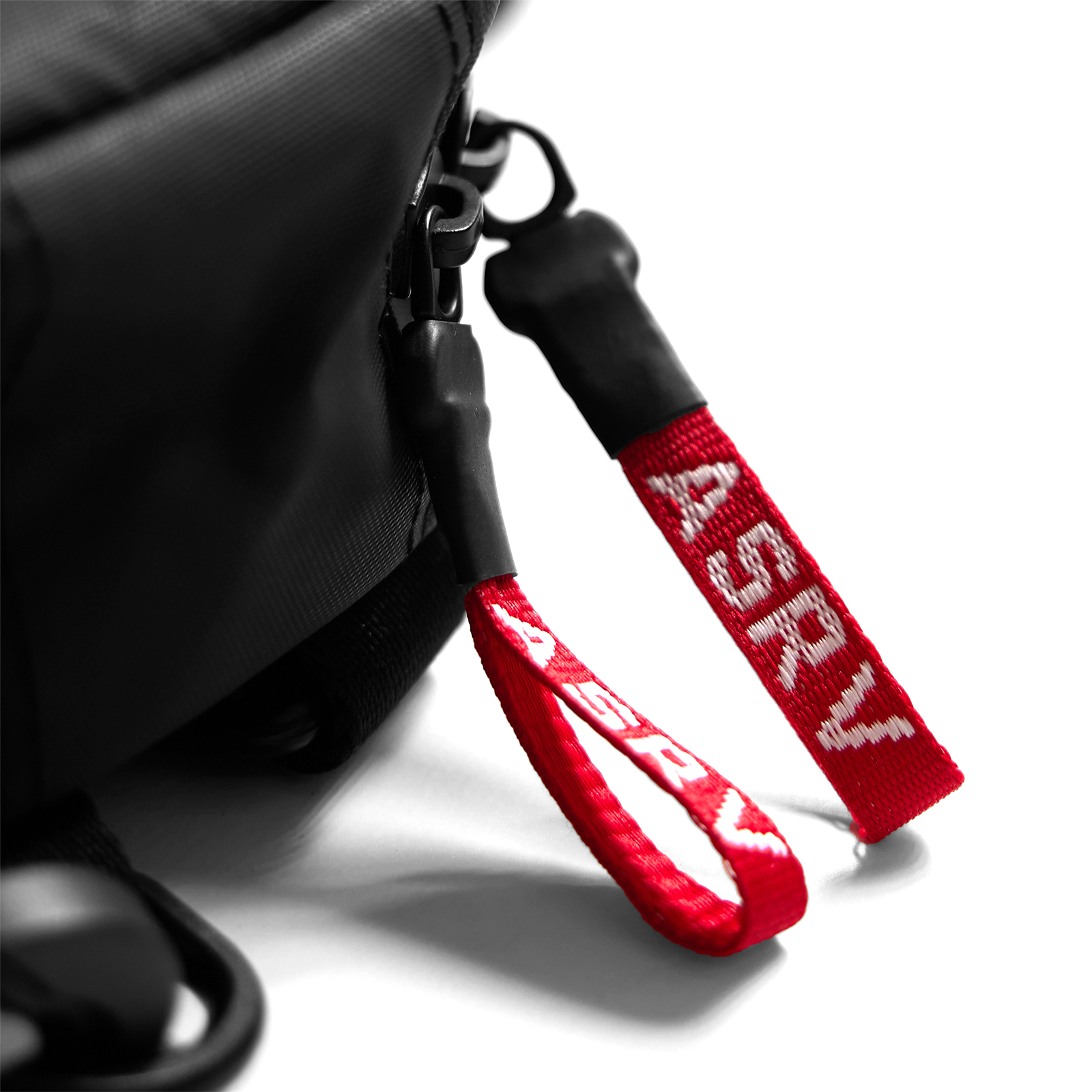 0360 Modular Hard Case Bag in black with red carry strap detail, held by hand