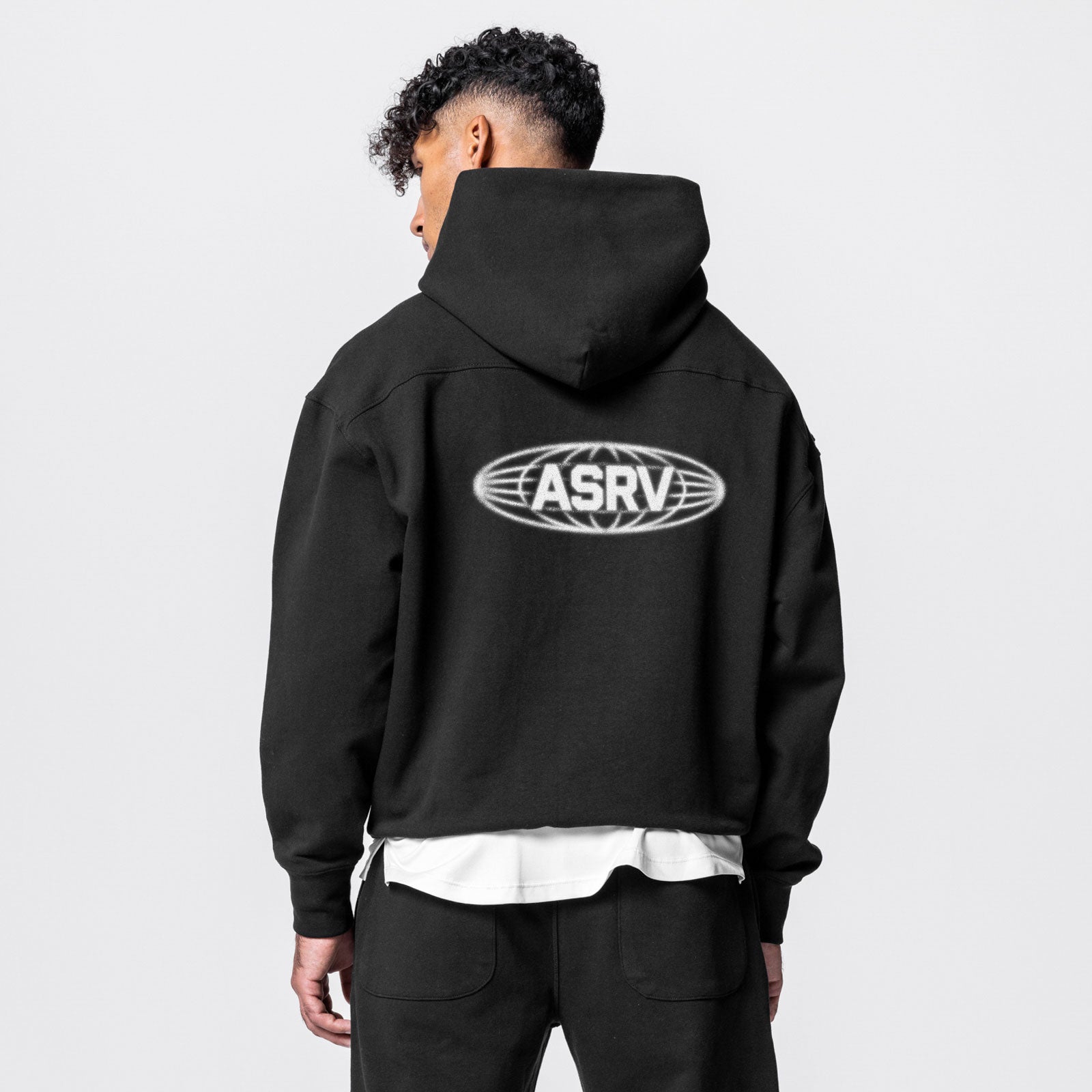 Tech-Terry™ Hoodie in black with ASRV logo, worn by model, back view