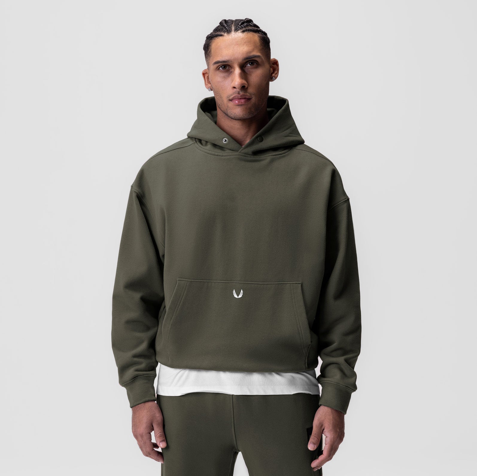 Tech-Terry Hoodie in olive worn by model, frontal view with white undershirt visible