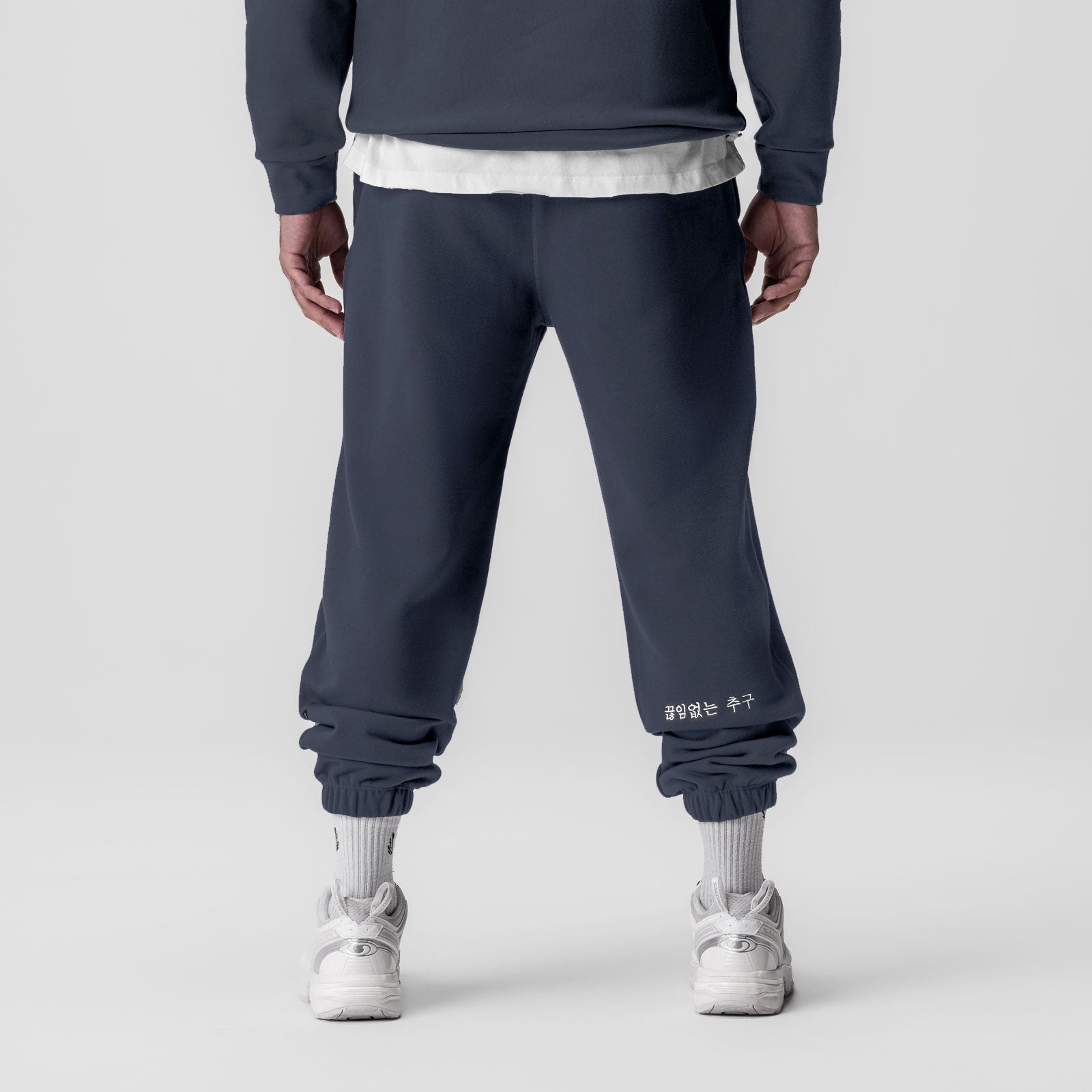 Tech-Terry Oversized Sweats in navy with white cuff detail, back view on model