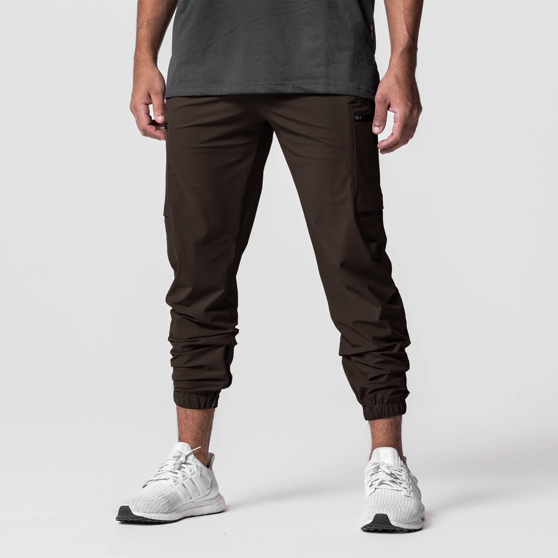 Dark brown Tetra-Lite Standard Zip Jogger worn with white sneakers, front view