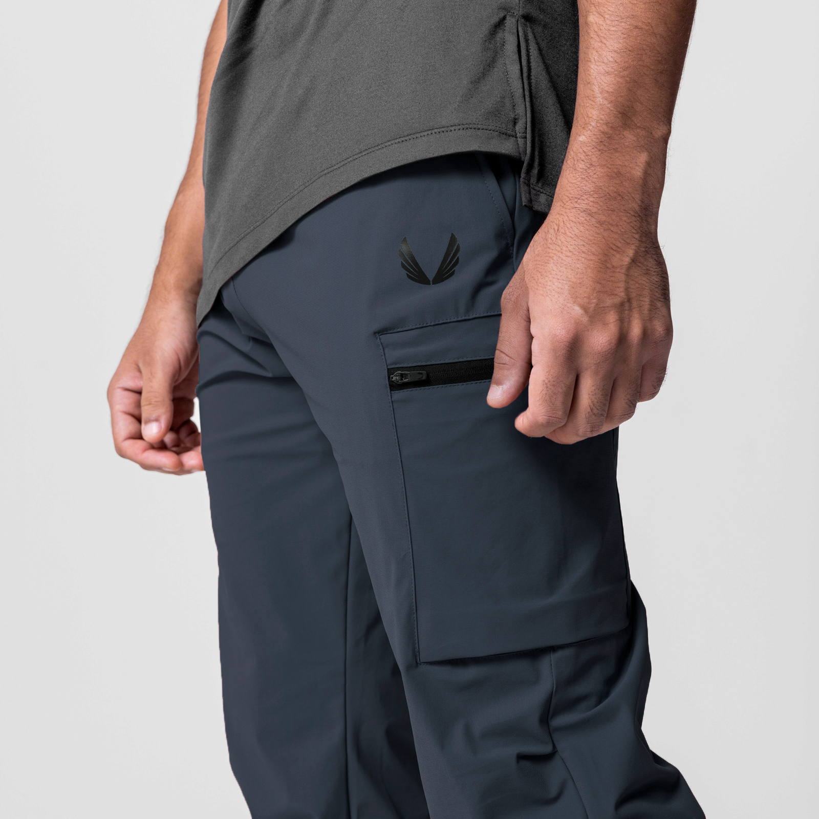 Tetra-Lite Standard Zip Jogger in navy worn by model, side view showing cargo pocket detail