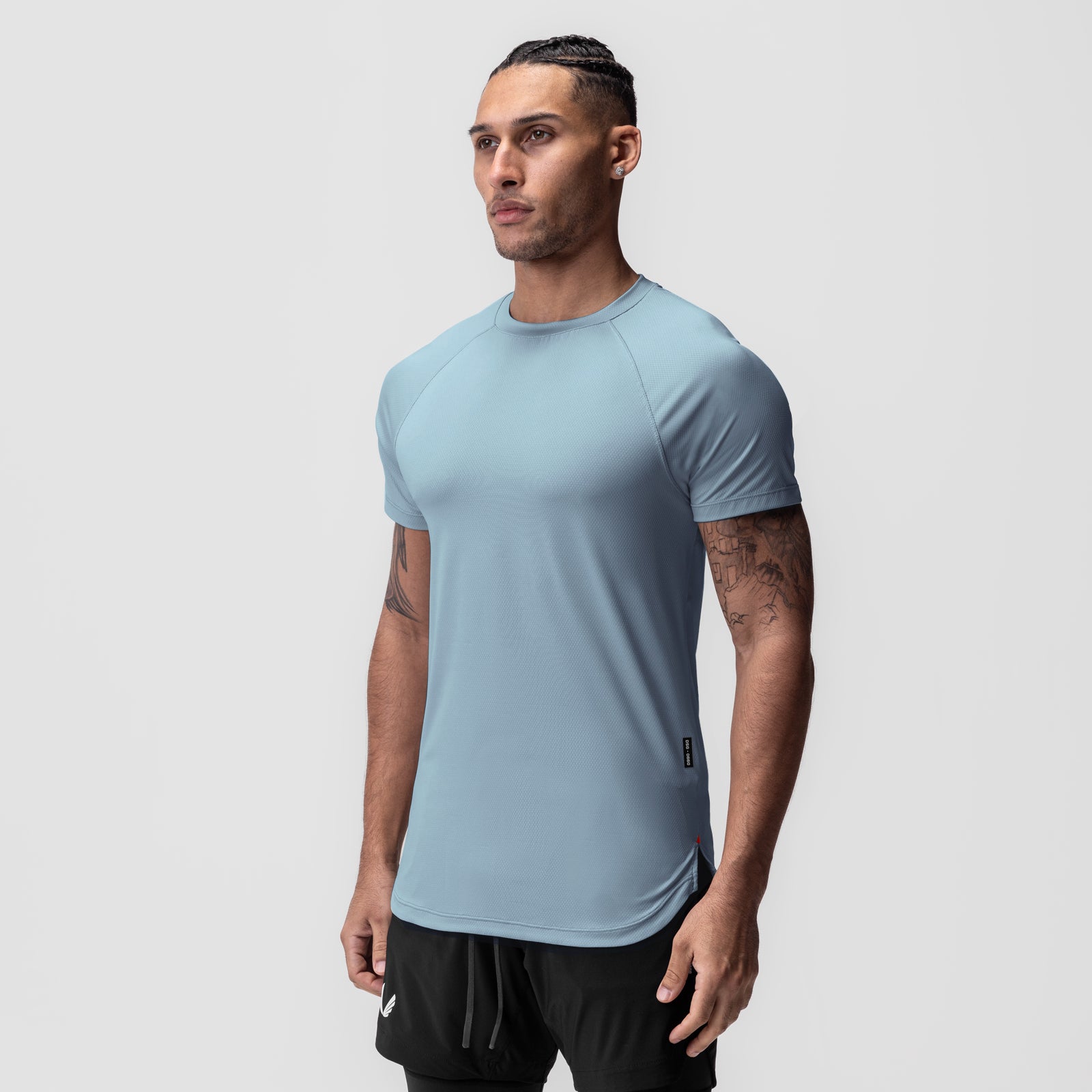 AeroSilver Established Tee in light sky blue, worn by model in three-quarter view