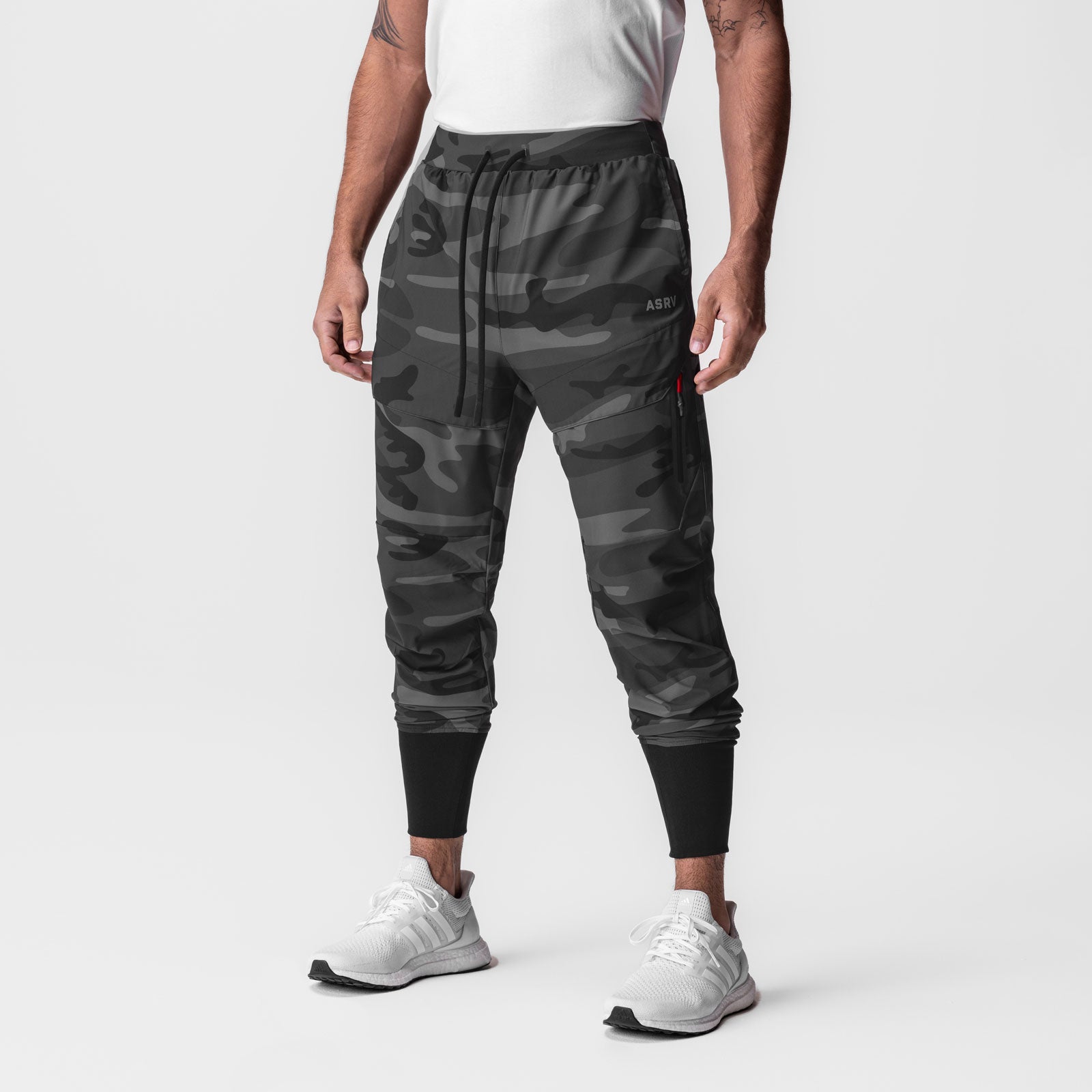 Black camo Tetra-Lite Tech High Rib Jogger worn by male model, front view