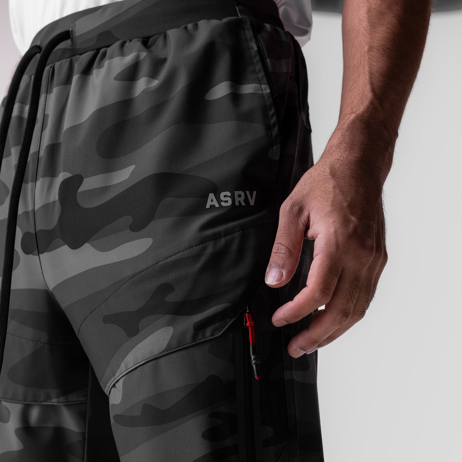 Tetra-Lite Tech High Rib Jogger in black camo, worn by model, side detail view