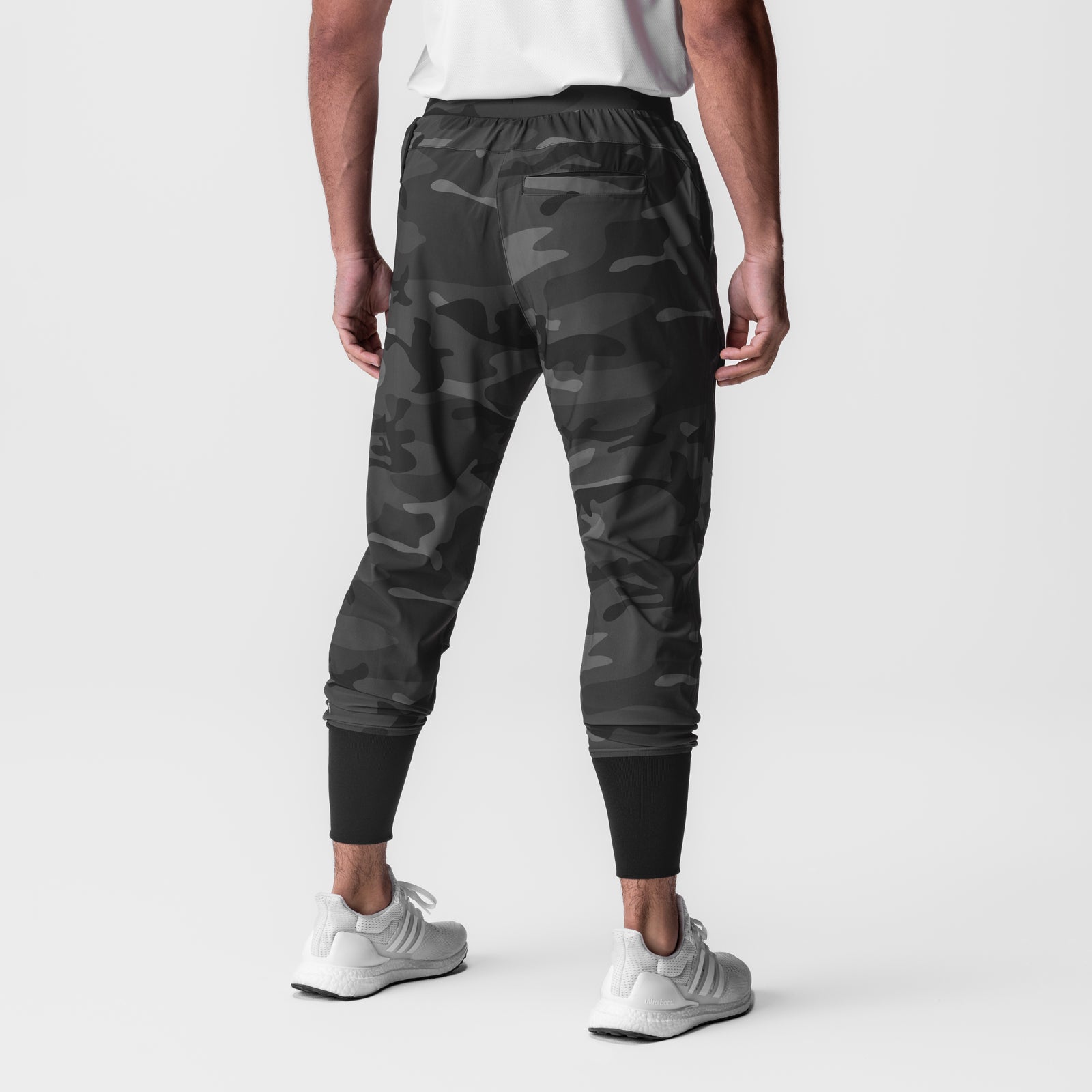Black camo Tetra-Lite Tech High Rib Jogger worn by model, back view