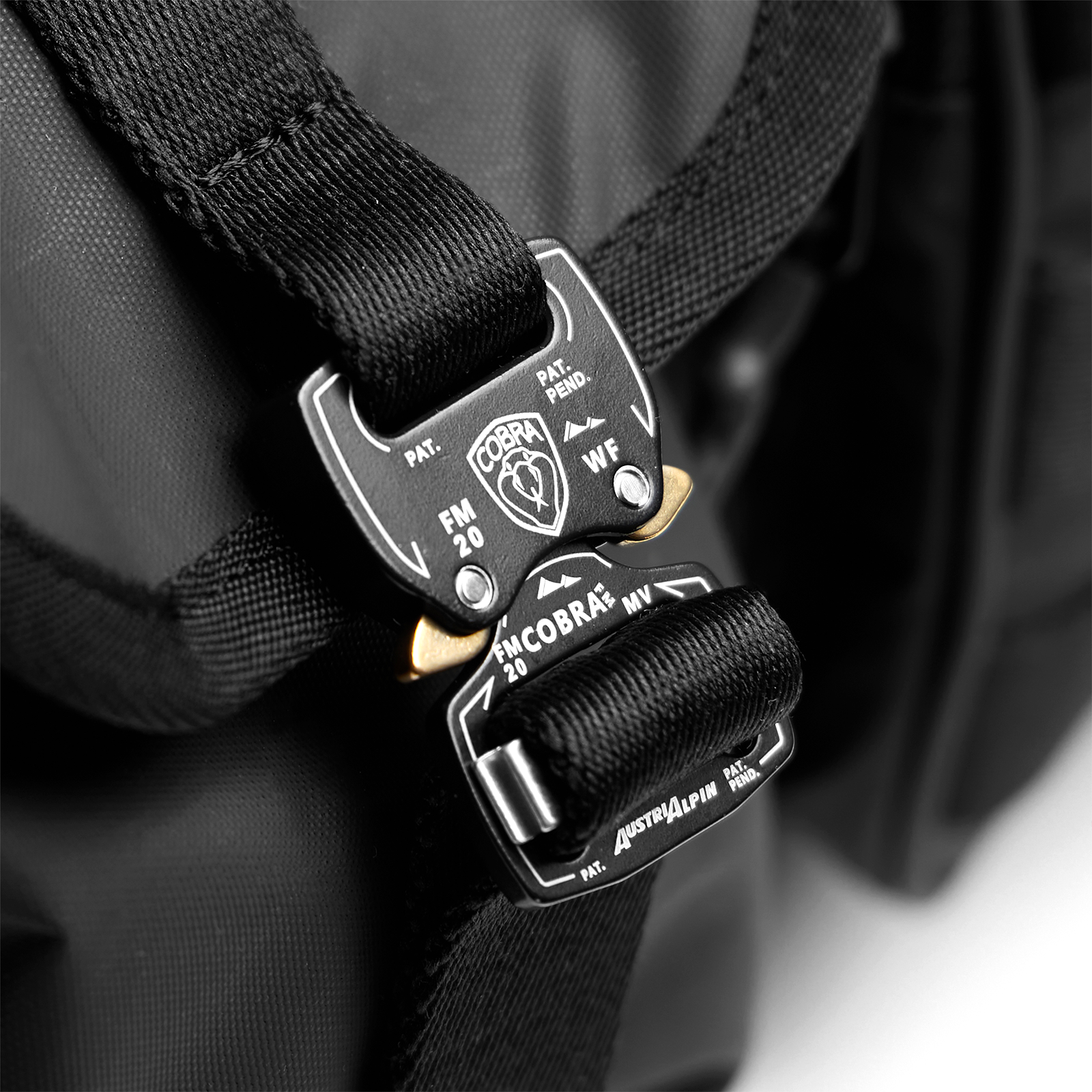0710 Utility Gym Duffle Bag in black, worn on shoulder with tactical carabiner detail