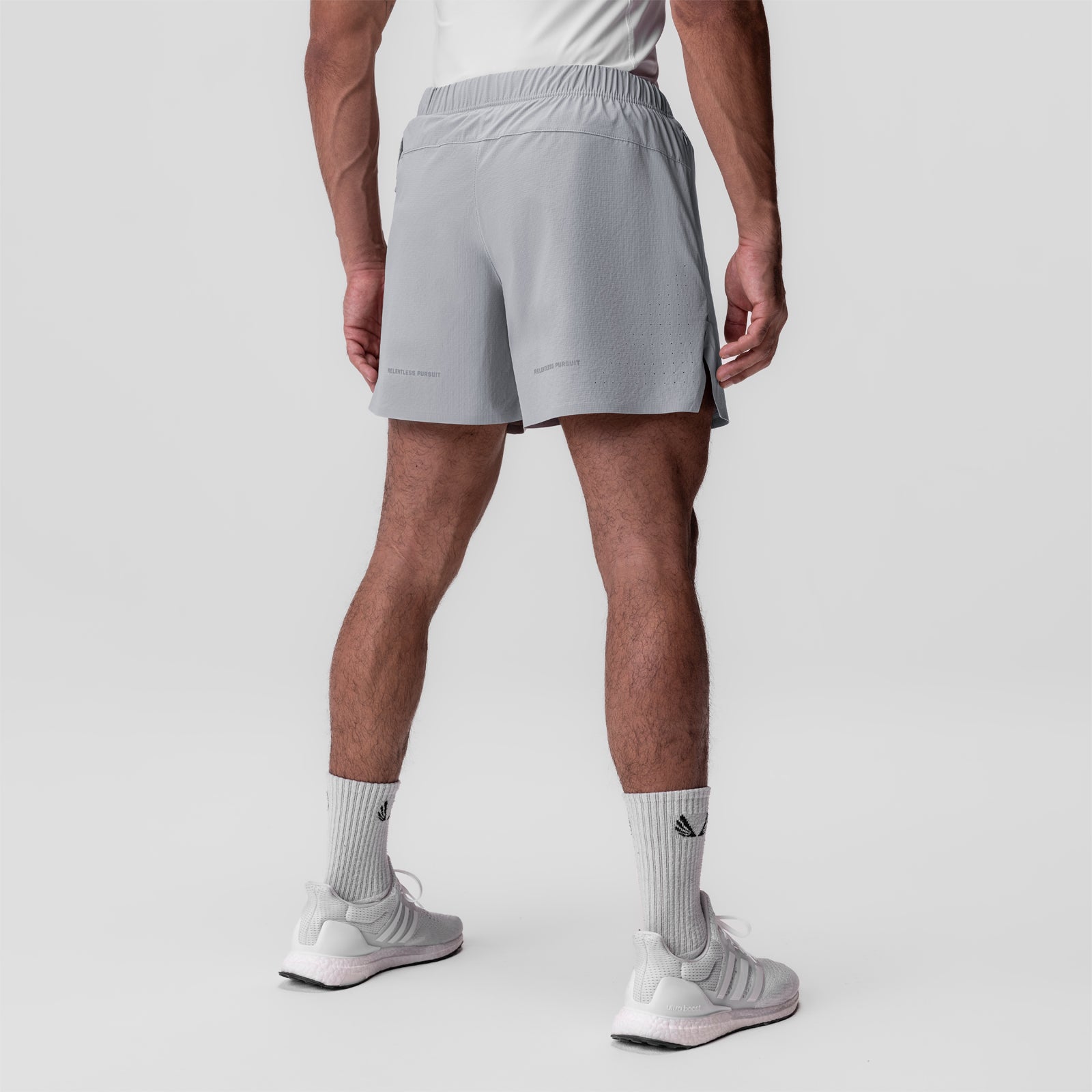 Ripstop 6" Perforated Short in slate grey, worn by model standing, back view