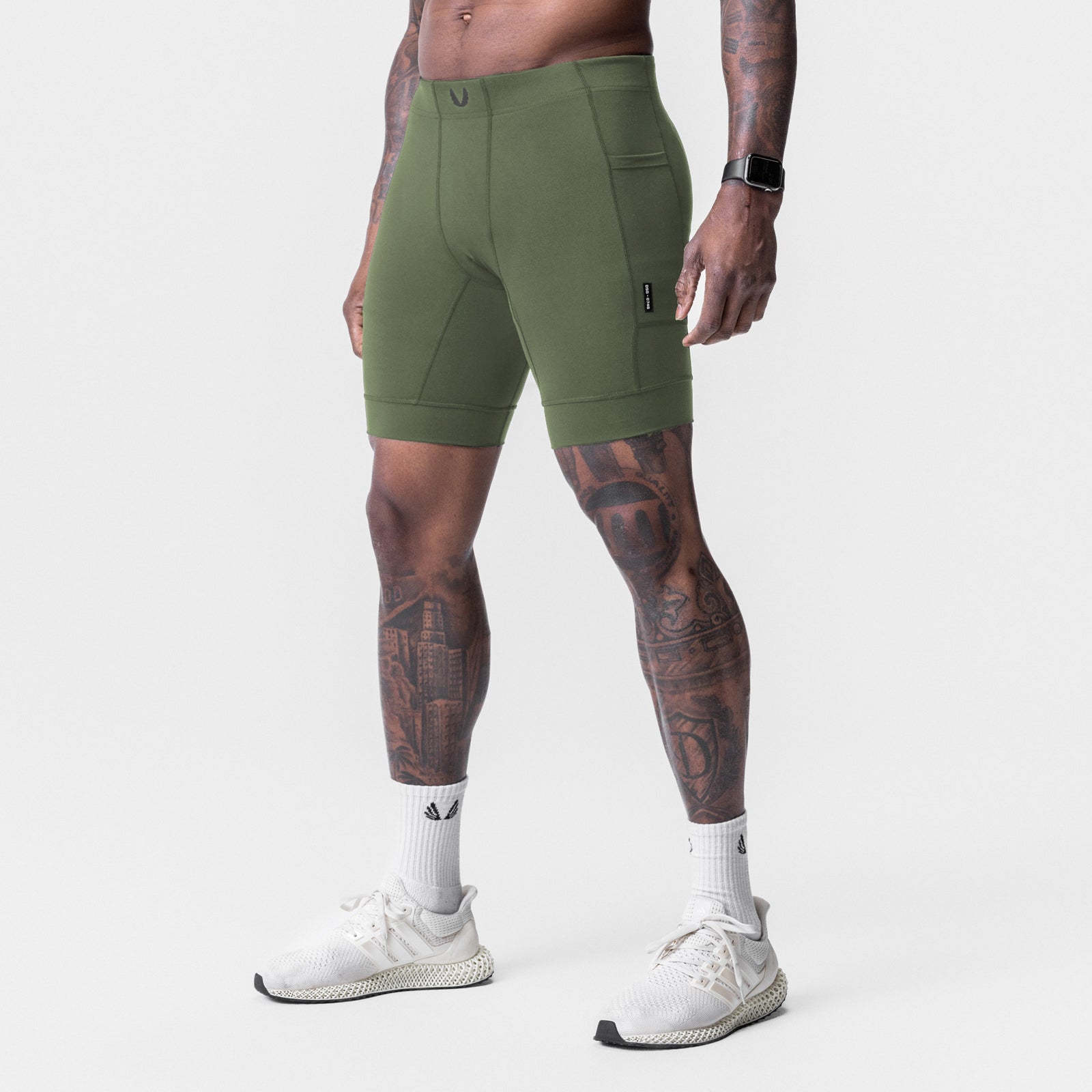 WarpFlexx® Side Pocket 1/2-Length Legging in olive, worn by model, side view