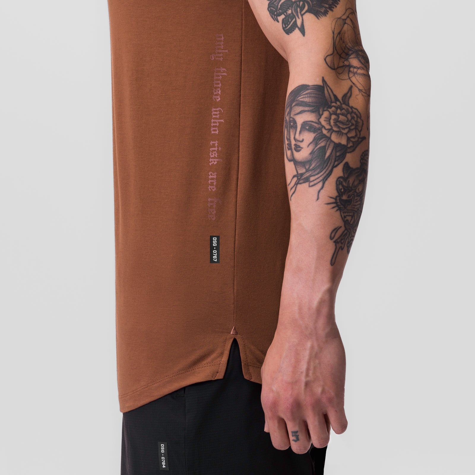 Supima® Established Tee in rust, worn by model showing side view with tattoos visible