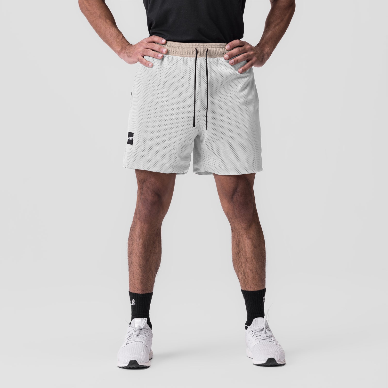 SilverPlus™ Mesh Reversible Short in beige, modeled front view on male wearer