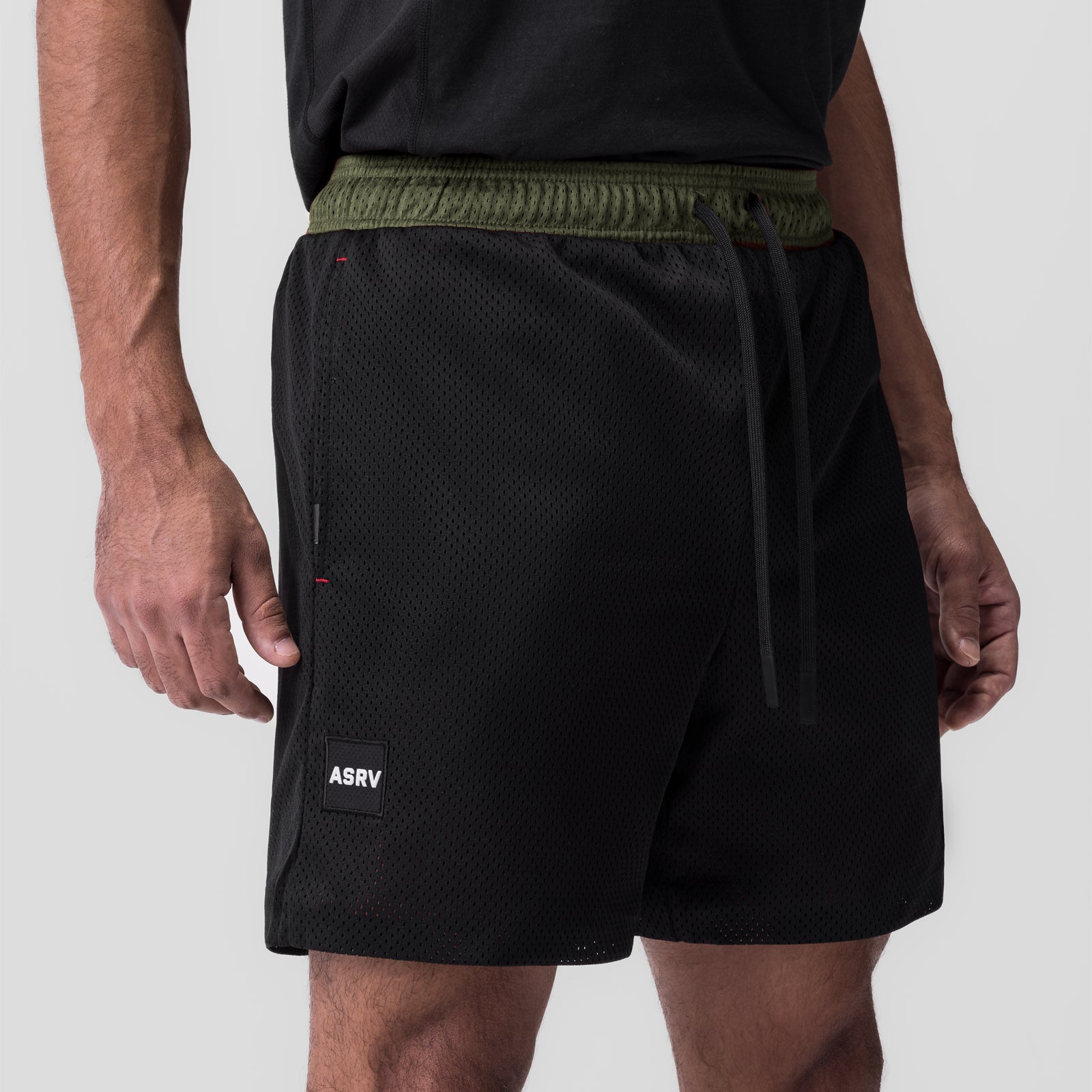 SilverPlus™ Mesh Reversible Short in black, worn by model, rear view