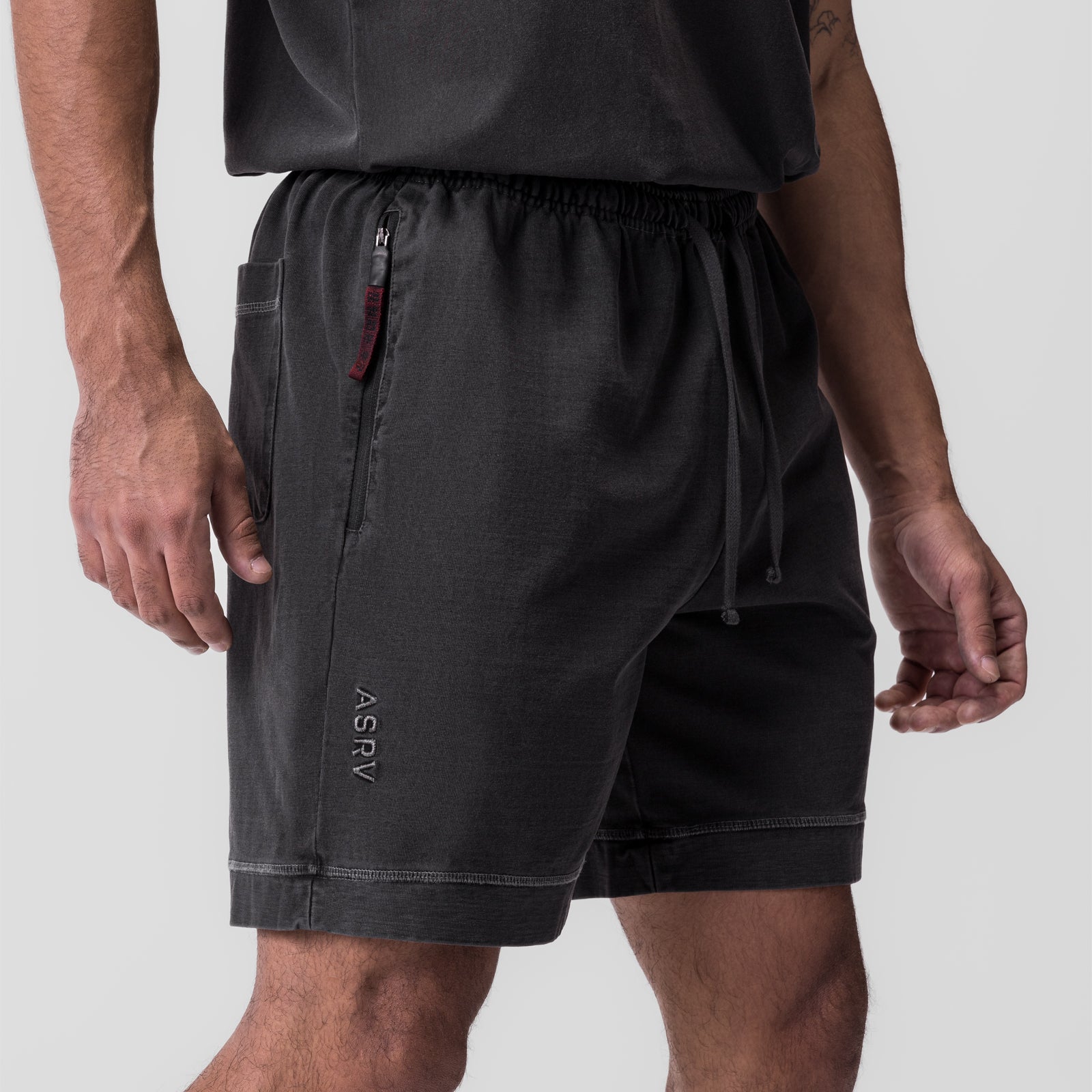 Tech Essential™ Sweat Short in faded grey worn by model, side view