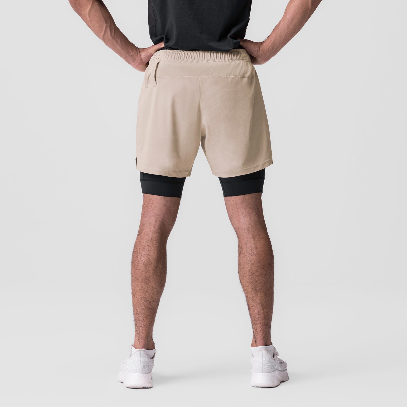 Ultralite 6" Liner Short in beige and black, worn by model, back view