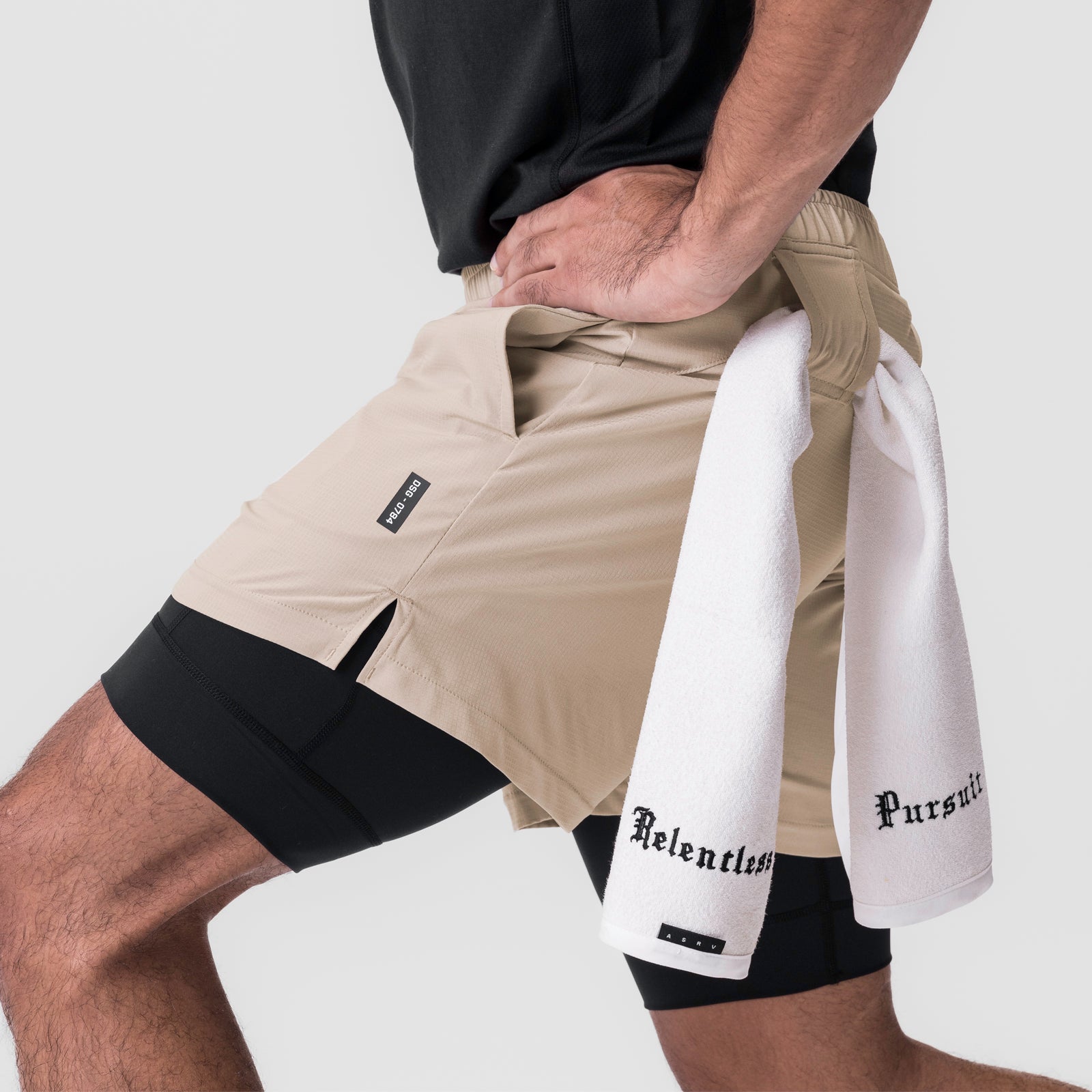 Ultralite™ 6" Liner Short in beige and black worn by model with white towel