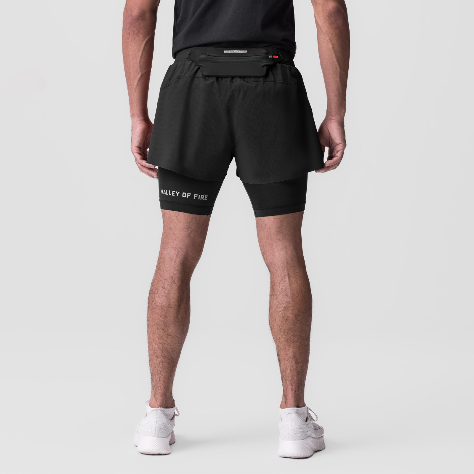 Ripstop 3" Belt Pack Short in black, back view on model with white sneakers