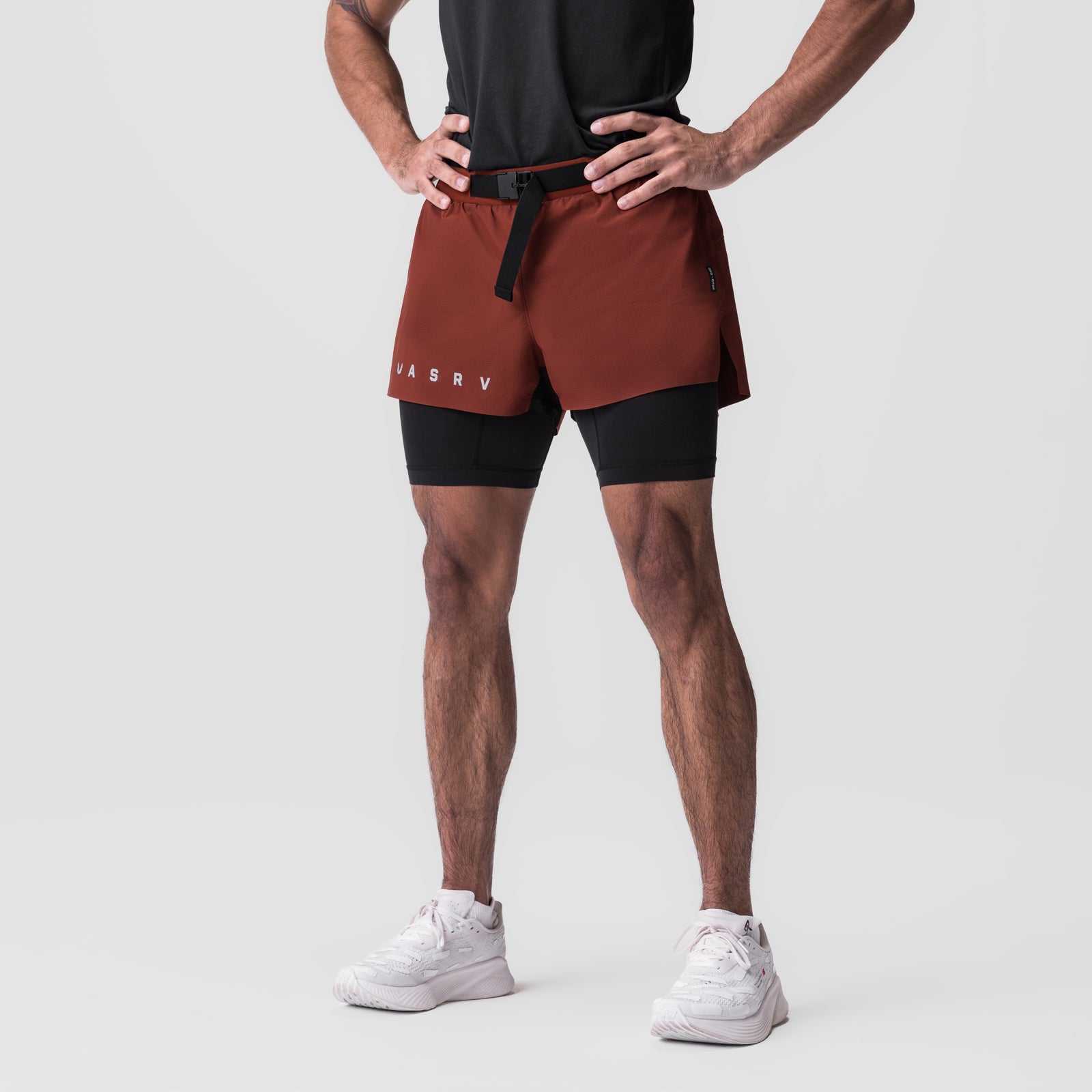 Ripstop 3" Belt Pack Short in brick red and black, worn by model with hands on hips
