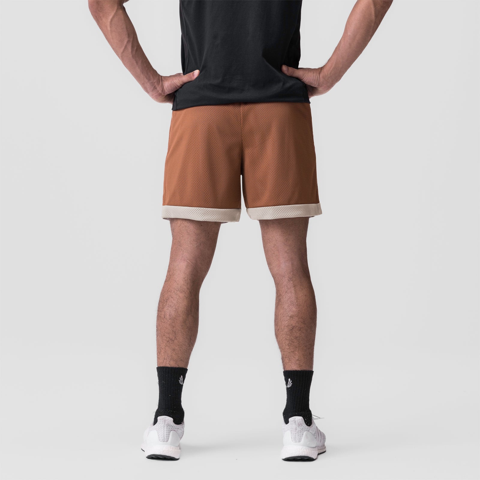 SilverPlus™ Mesh Reversible Short in Rust/Beige worn by model, back view