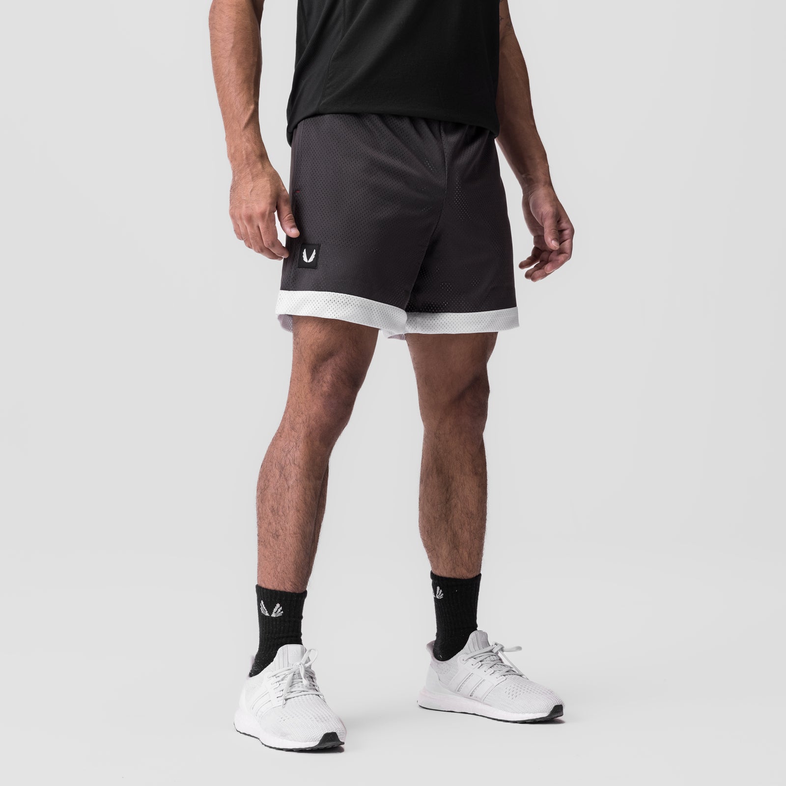 SilverPlus Mesh Reversible Short in Raven/White, modeled from front