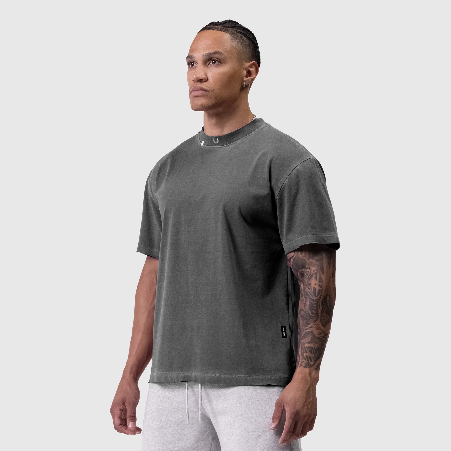 Tech Essential Relaxed Tee in faded grey worn by model, front view