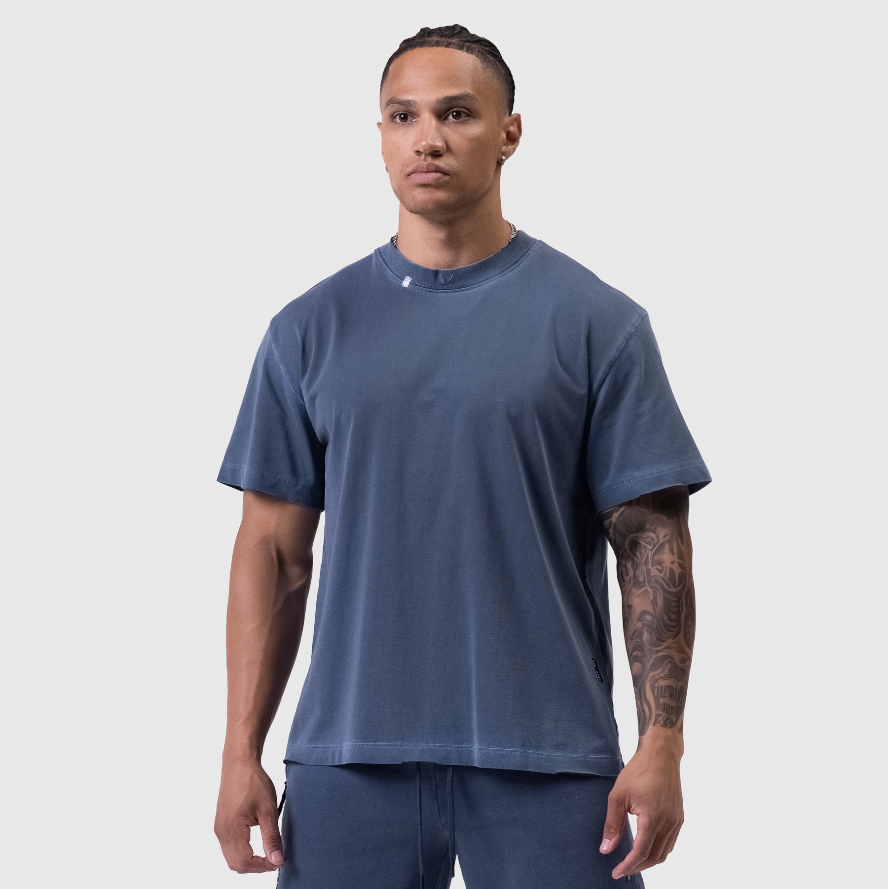 Tech Essential™ Relaxed Tee in faded navy worn by male model, front view