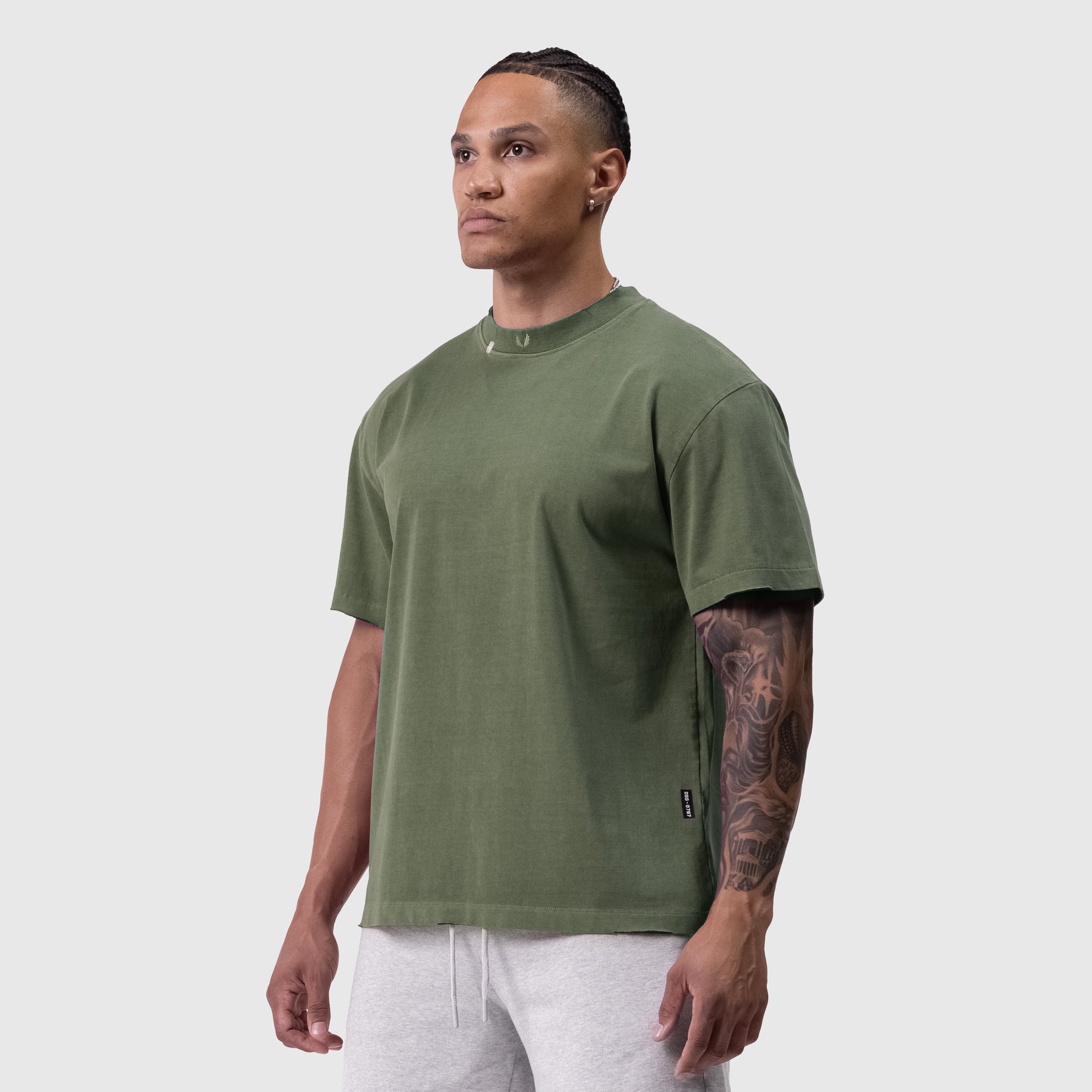 Tech Essential Relaxed Tee in faded olive worn by model, front view
