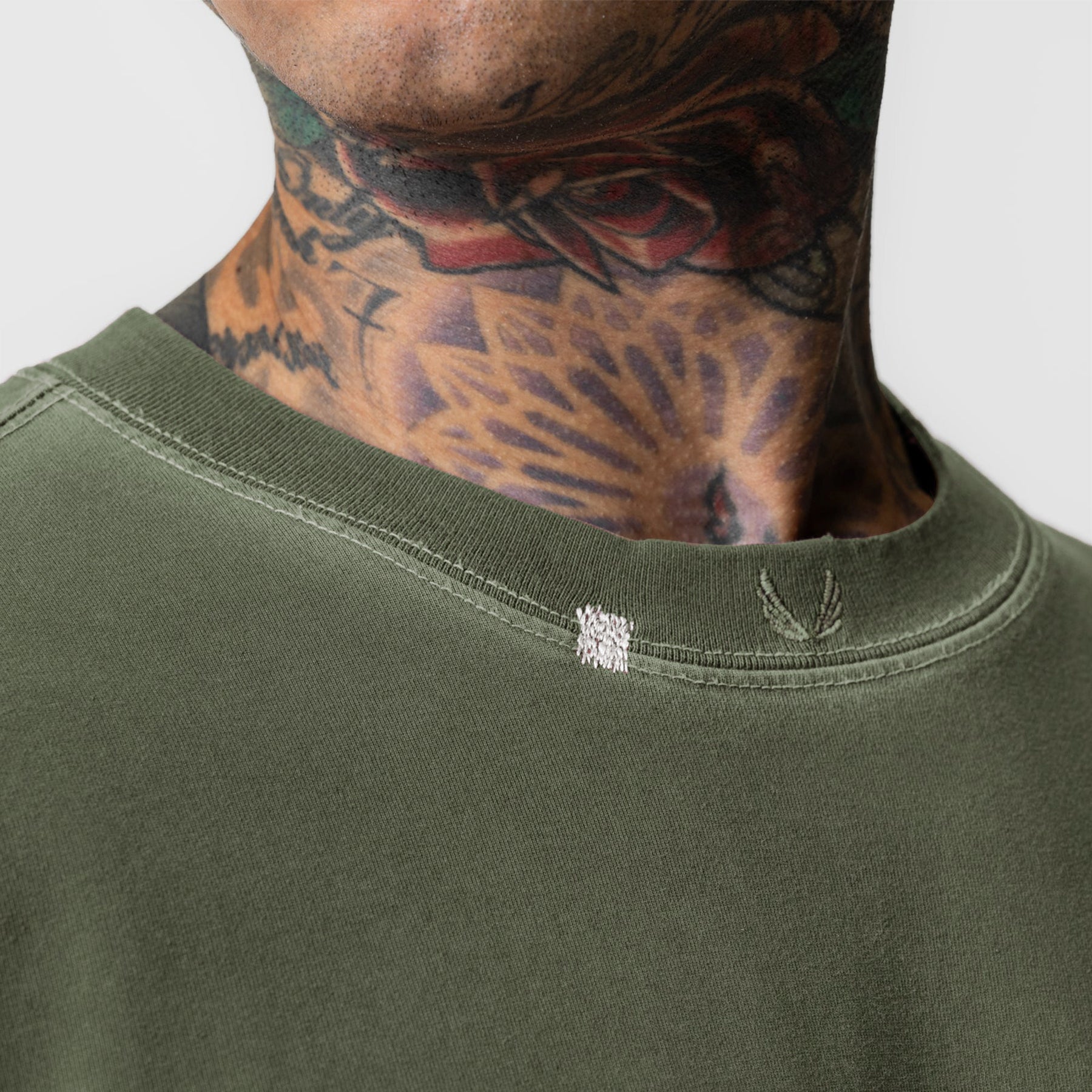 Tech Essential Relaxed Long Sleeve in Faded Olive worn by model, showing neckline detail