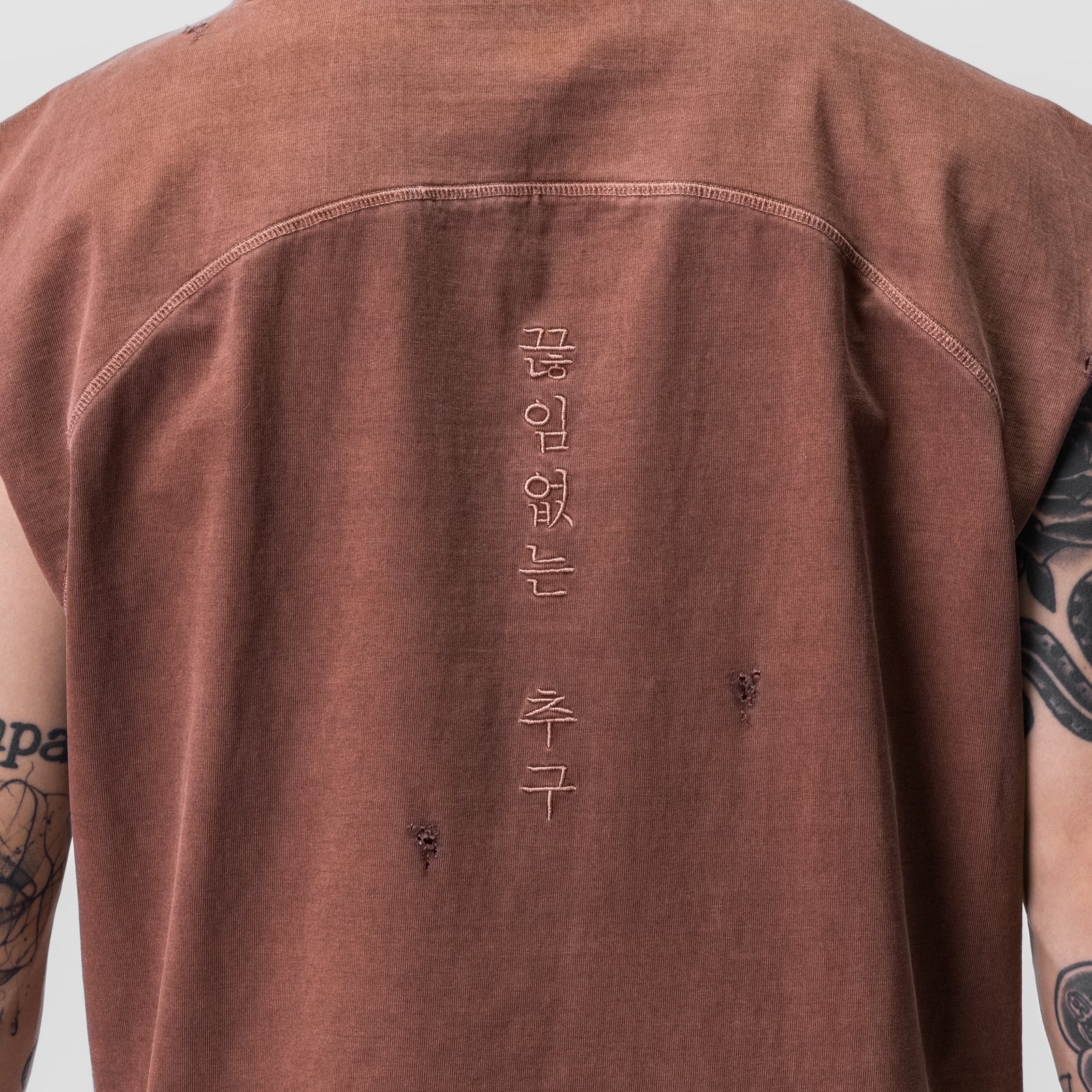 Tech Essential Cutoff Hoodie in faded brick worn by model, back view with Korean text