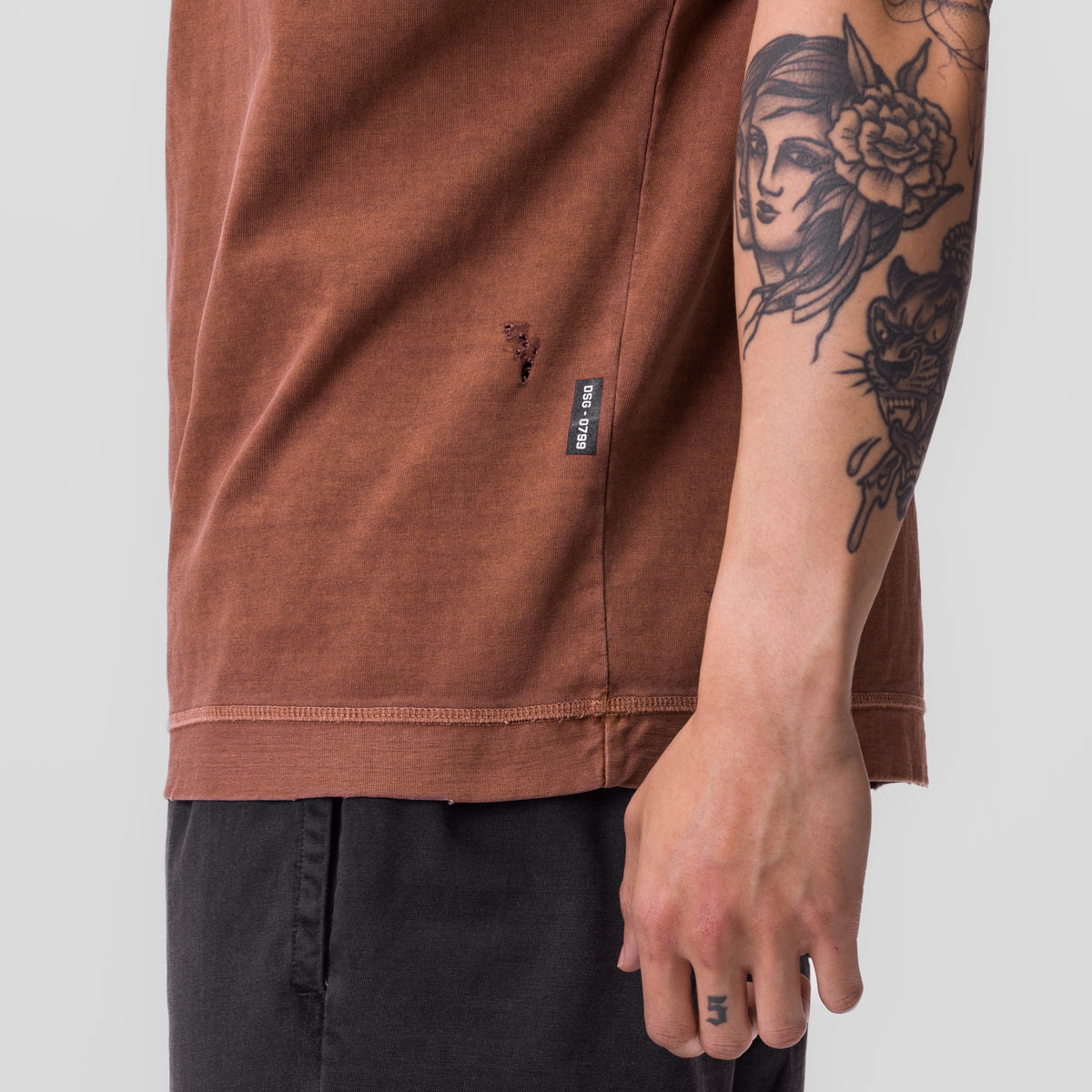 Tech Essential Cutoff Hoodie in faded rust worn by model, side view detail