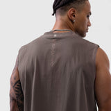 Tech Essential Relaxed Cutoff tank in faded dark earth, worn by model showing back view