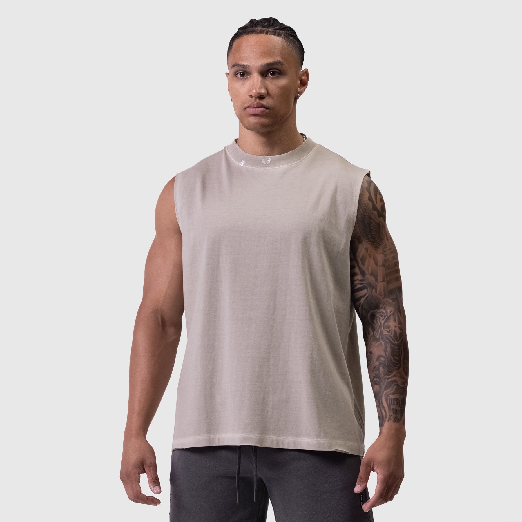Tech Essential Relaxed Cutoff sleeveless tank in faded chai, front view on model