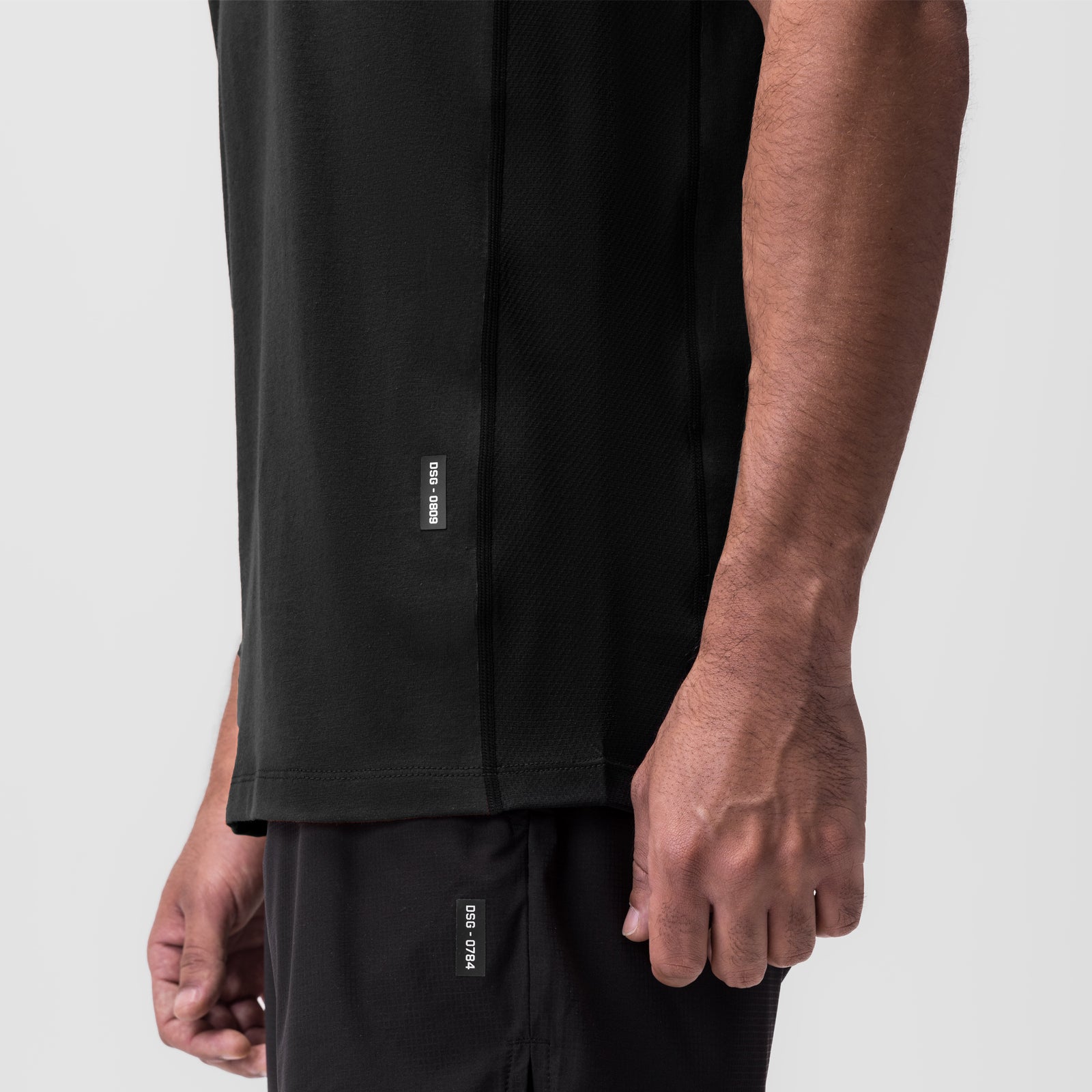 Black Supima® Mesh Panel Training Singlet worn by model, side view showing mesh paneling