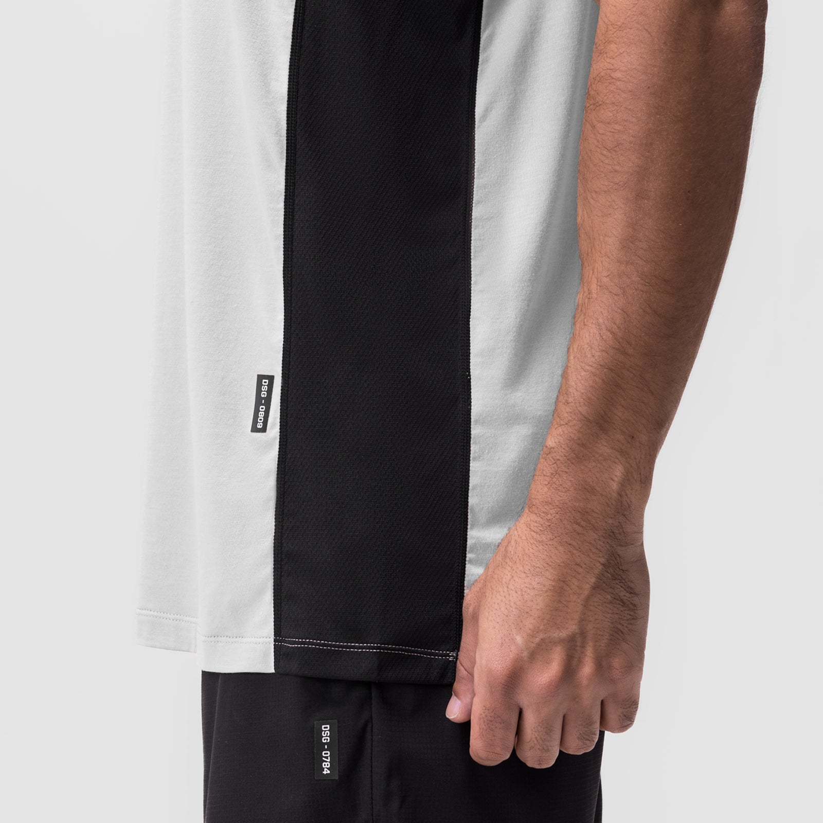 Supima® Mesh Panel Training Singlet in white and black, worn by model, side view detail