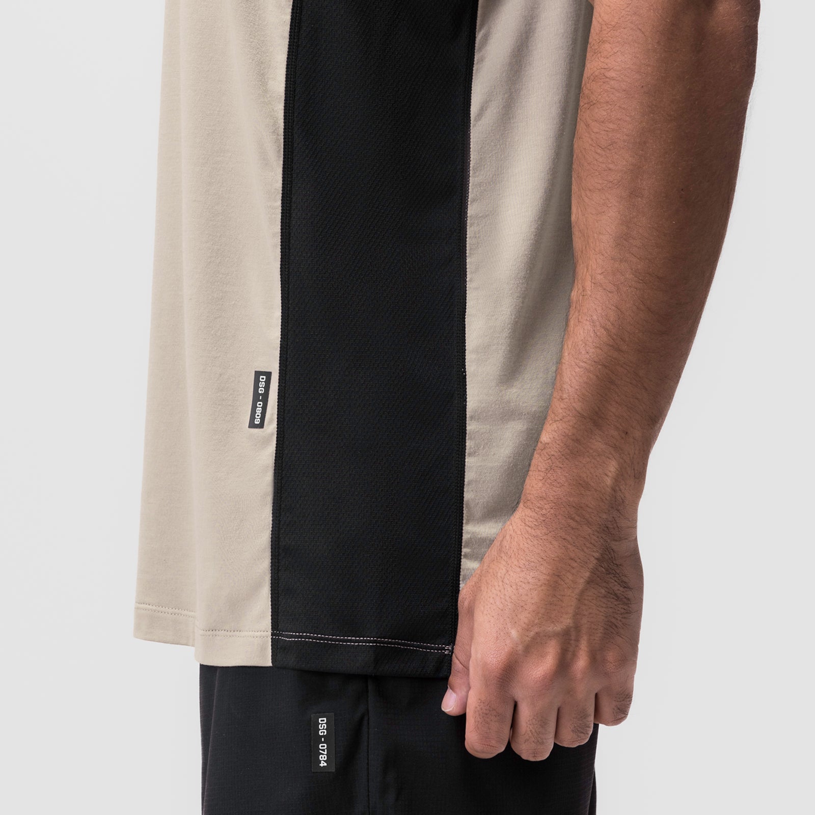 Supima® Mesh Panel Training Singlet in sand and black worn by model, side detail view