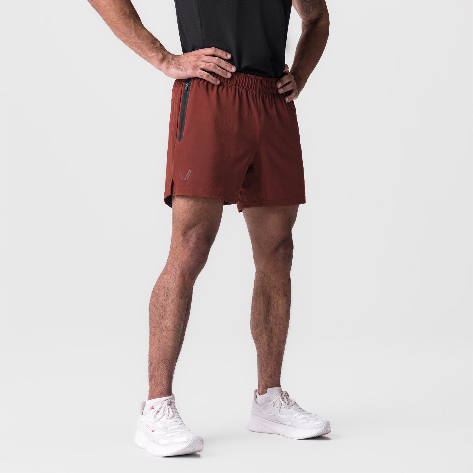 Ultralite 6" Linerless Short in brick, modeled on male figure from waist down