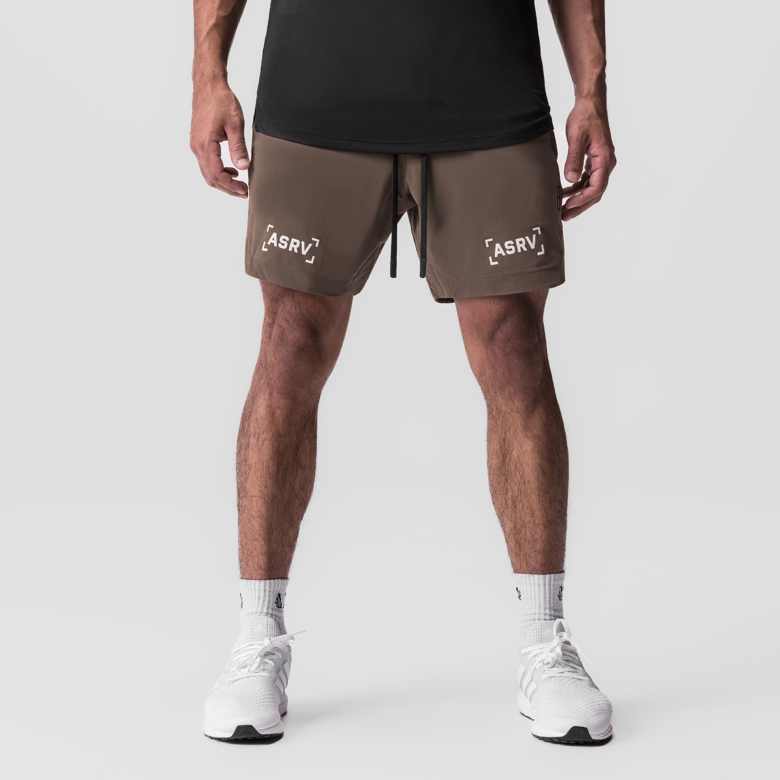 Tetra-Lite 7" Linerless Short in deep taupe with bracket logo, front view on model