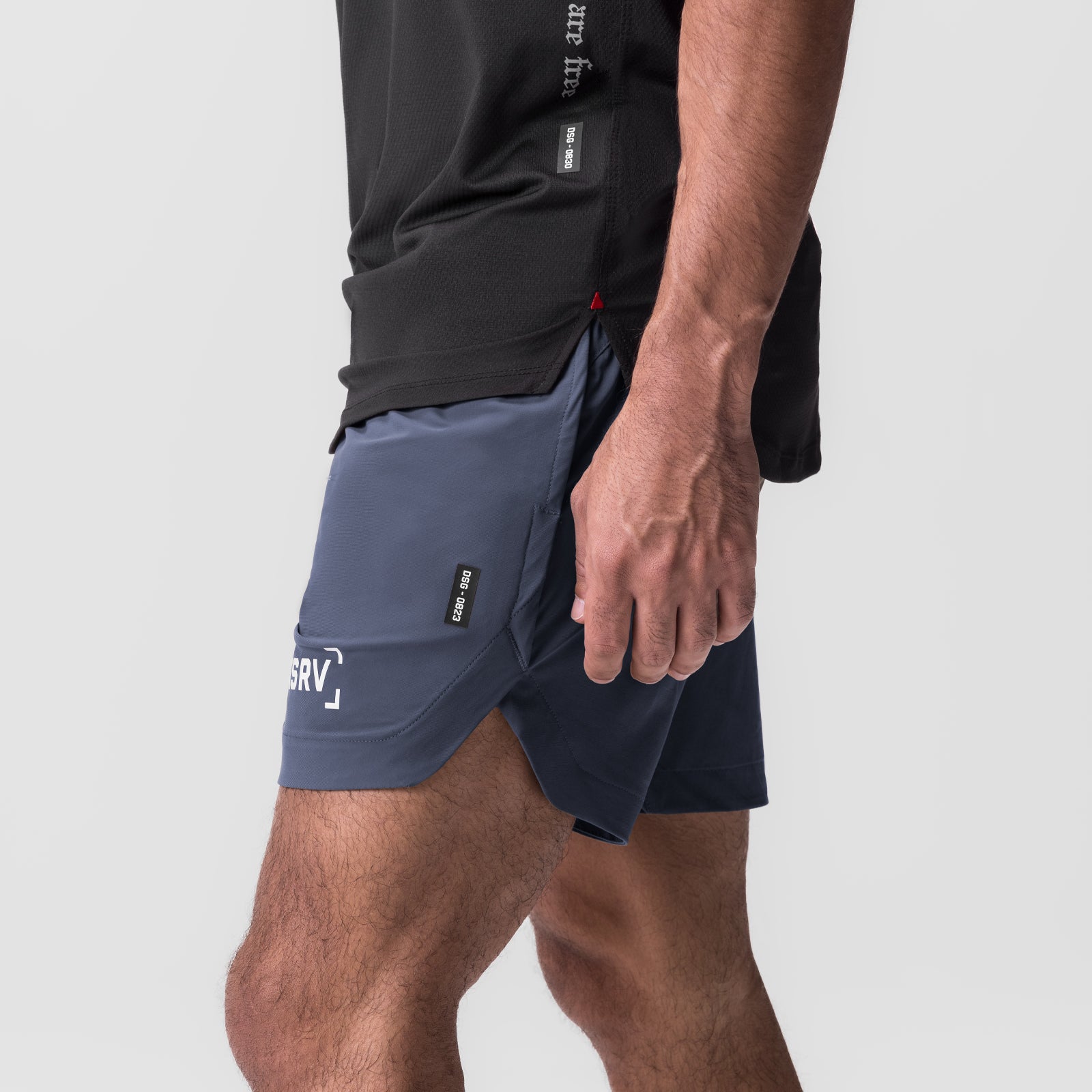 Tetra-Lite 7" Linerless Short in navy, worn by model, side view