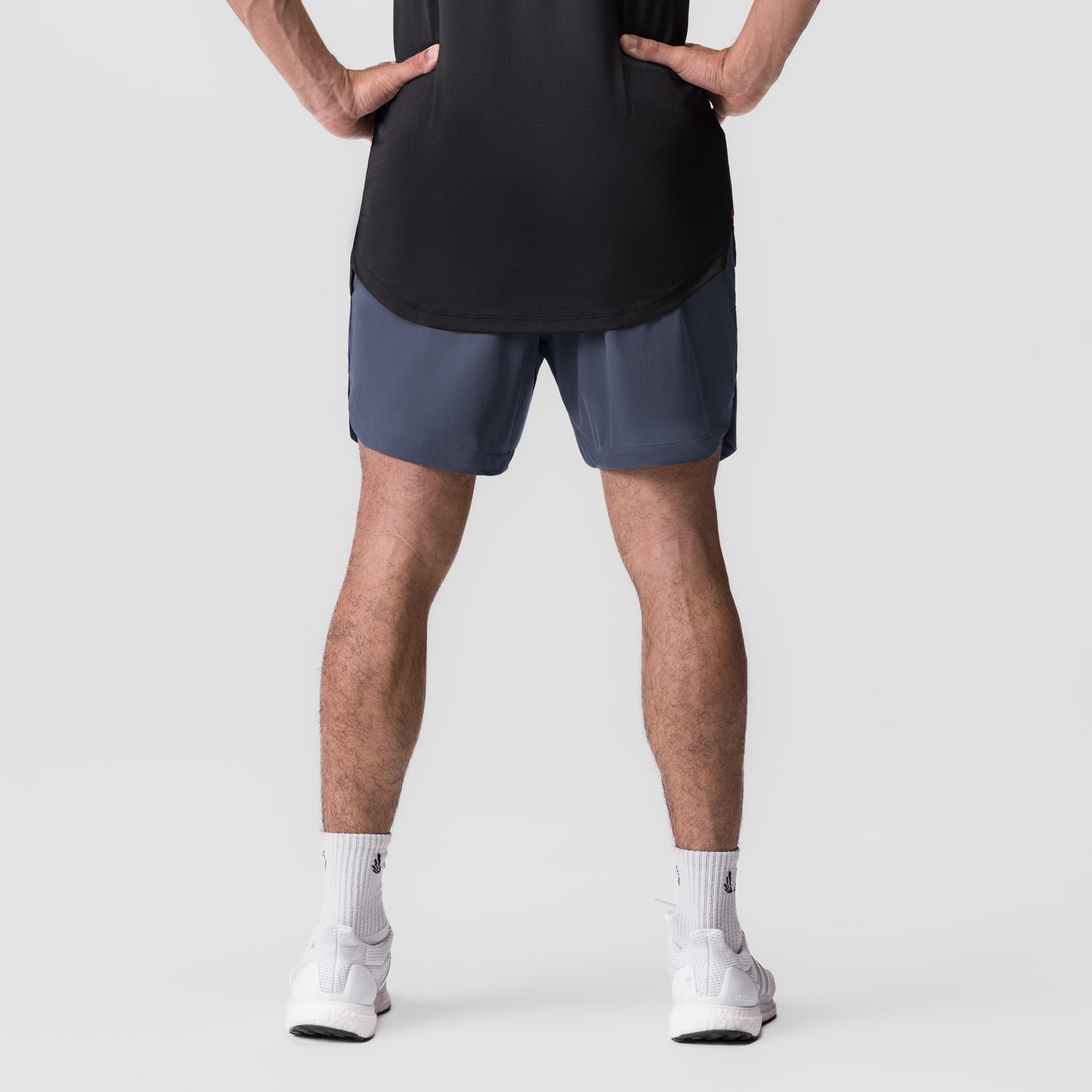 Tetra-Lite 7" Linerless Short in navy, modeled from front with hands on hips