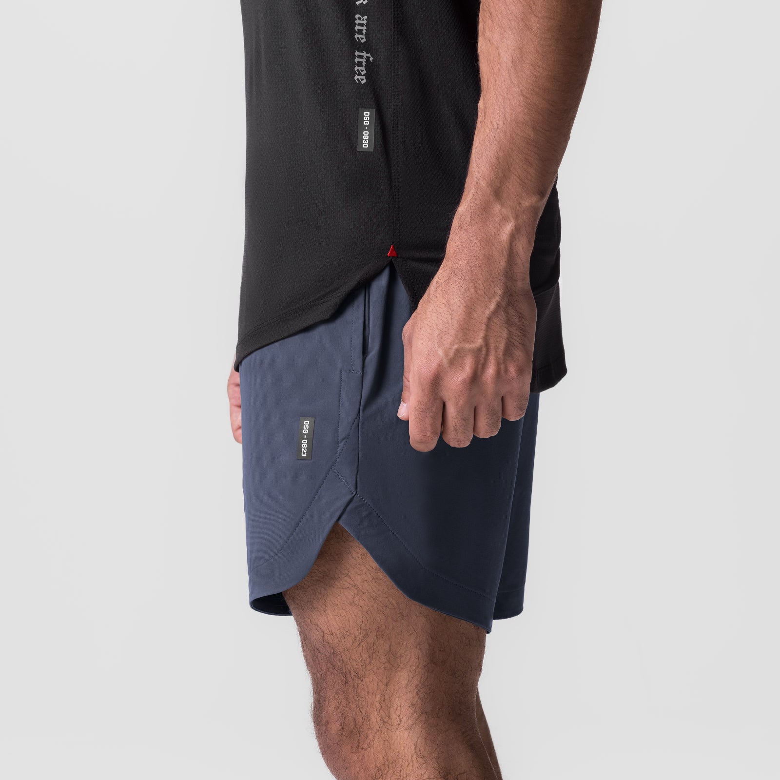 Navy Tetra-Lite 7" Linerless Short worn by model, side view
