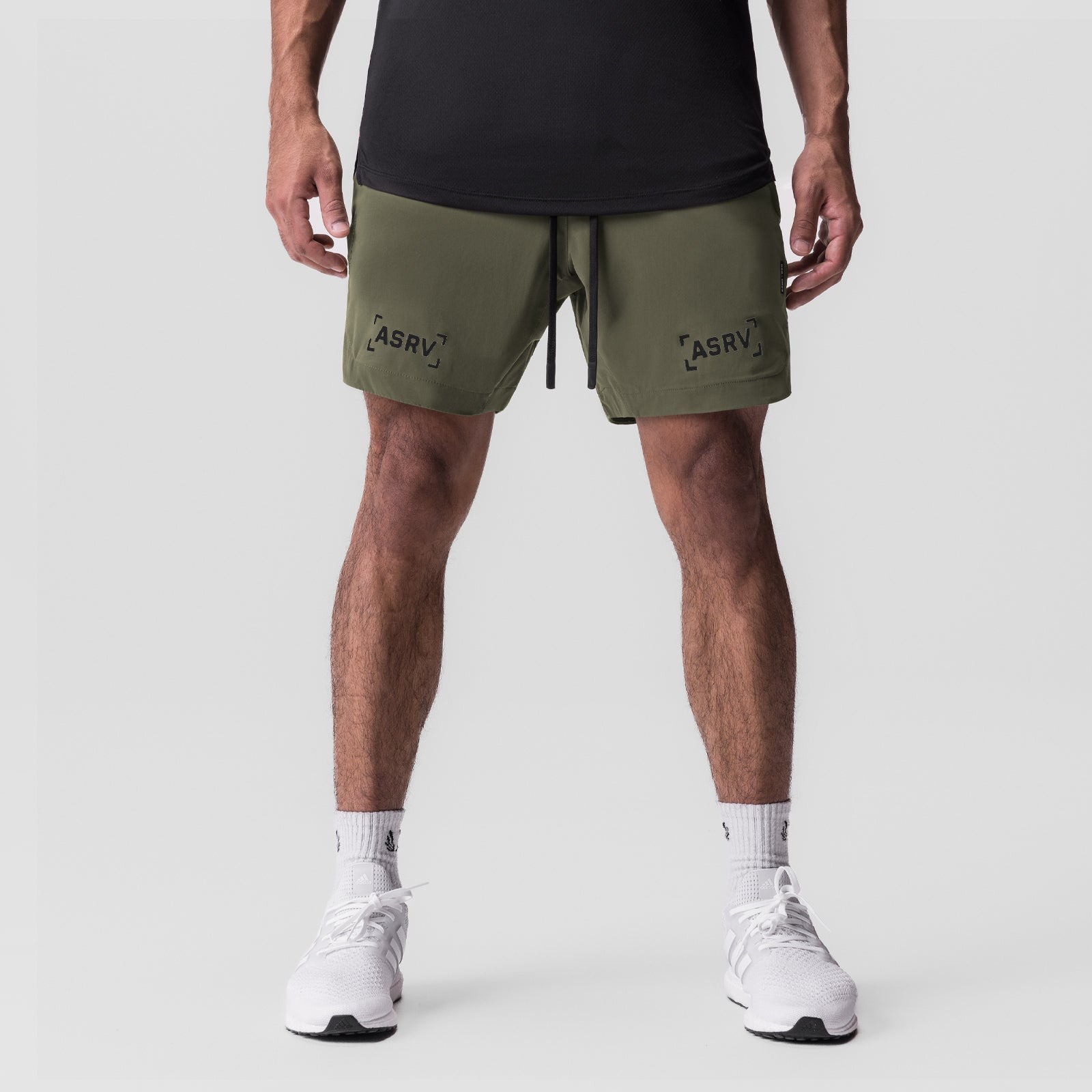 Tetra-Lite 7" Linerless Short in olive with bracket logo, front view on model