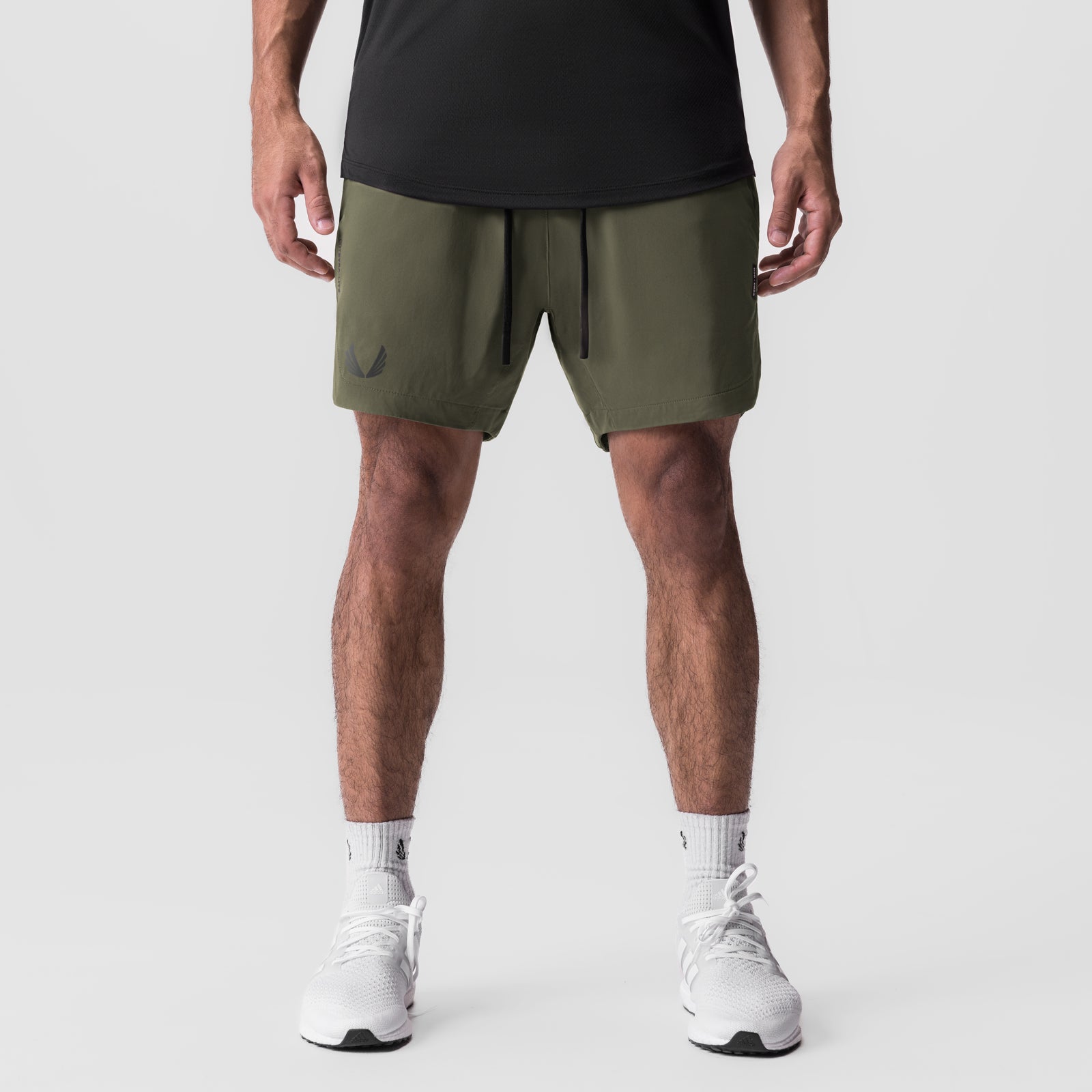 Tetra-Lite 7" Linerless Short in olive, worn by model, front view