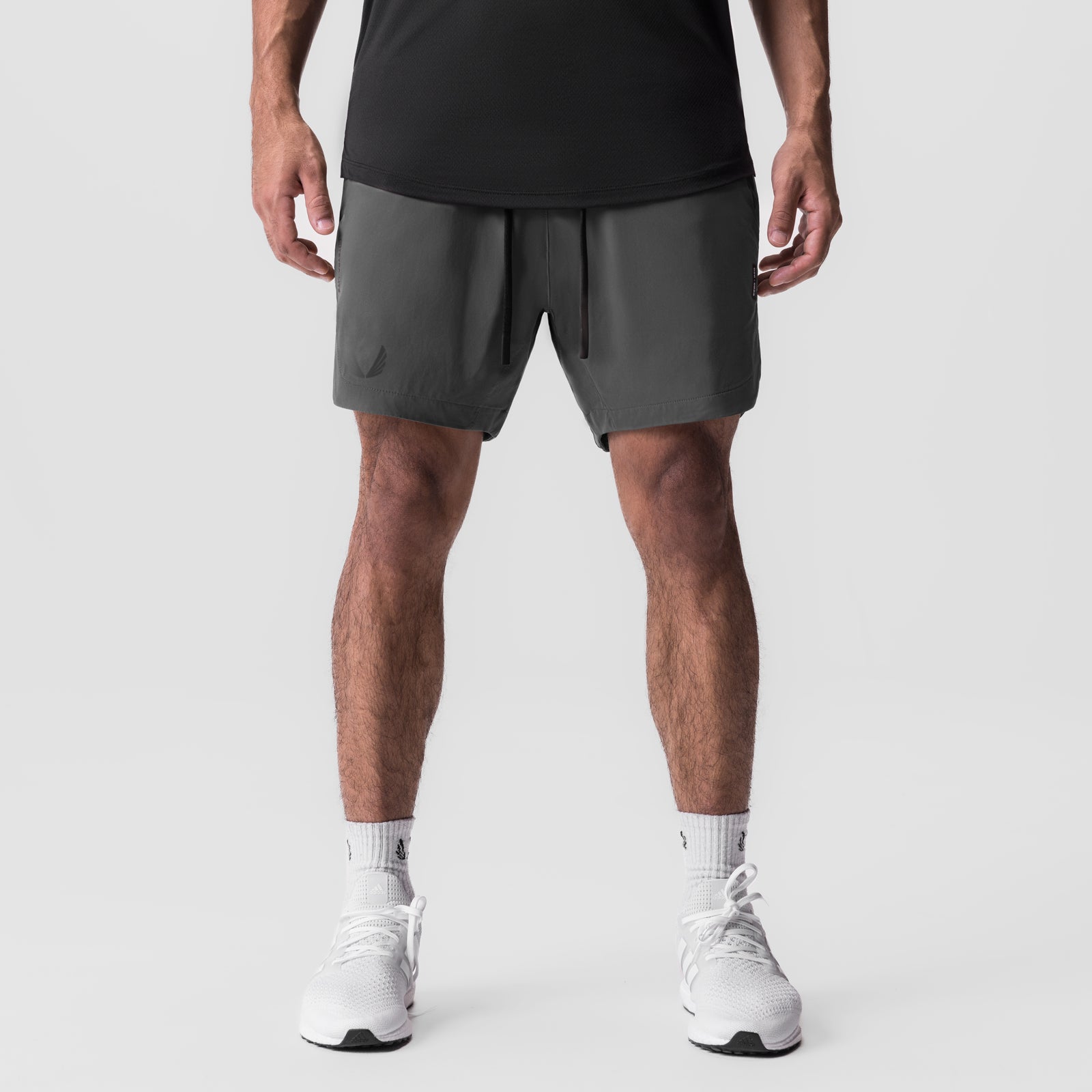Tetra-Lite 7" Linerless Short in Raven worn by model, front view