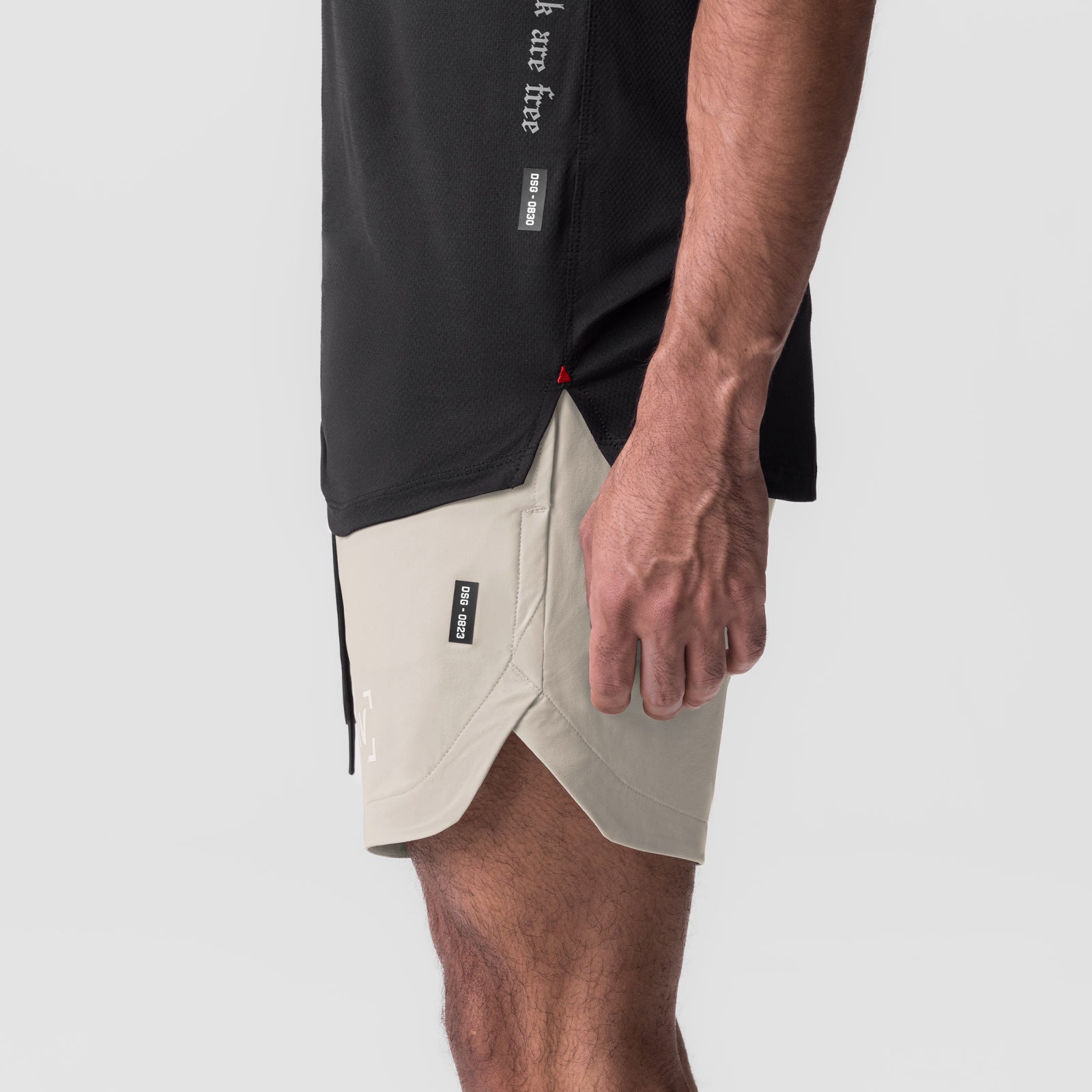 Tetra-Lite 7" Linerless Short in Sand Smoke, worn with black t-shirt, side view