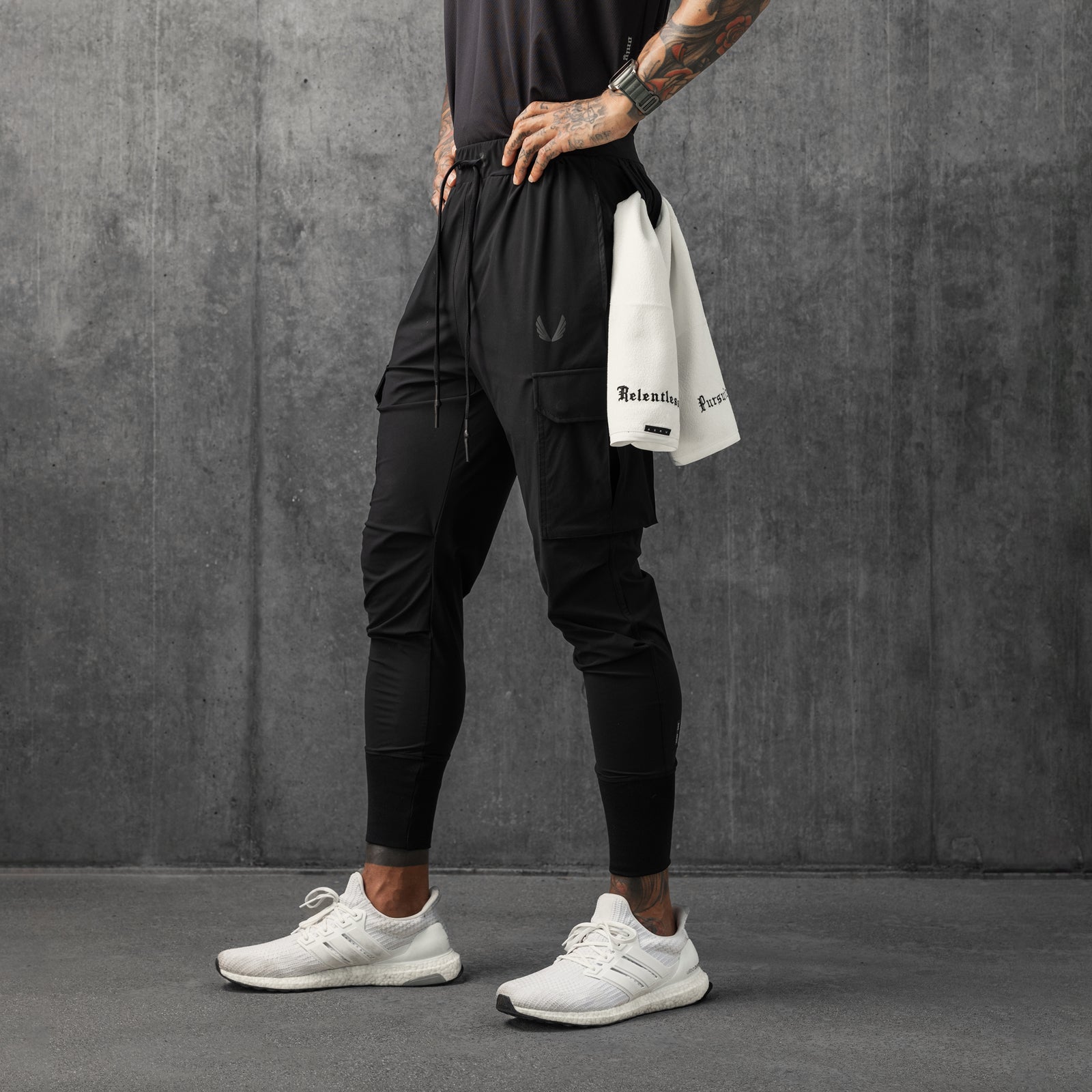 Tetra-Lite Cargo High Rib Jogger in black, worn with white sneakers and white shirt