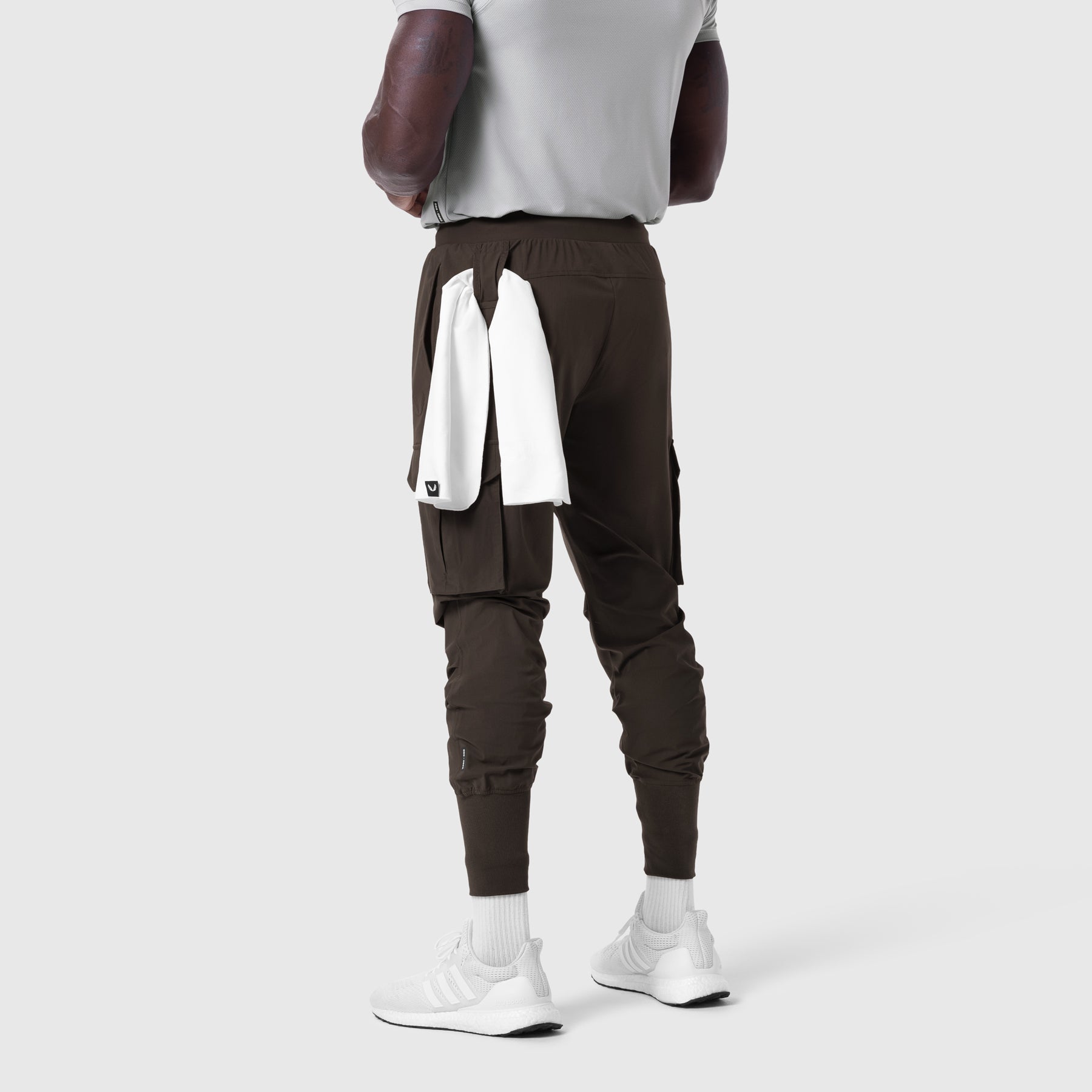 Tetra-Lite Cargo High Rib Jogger in Dark Earth, back view on model
