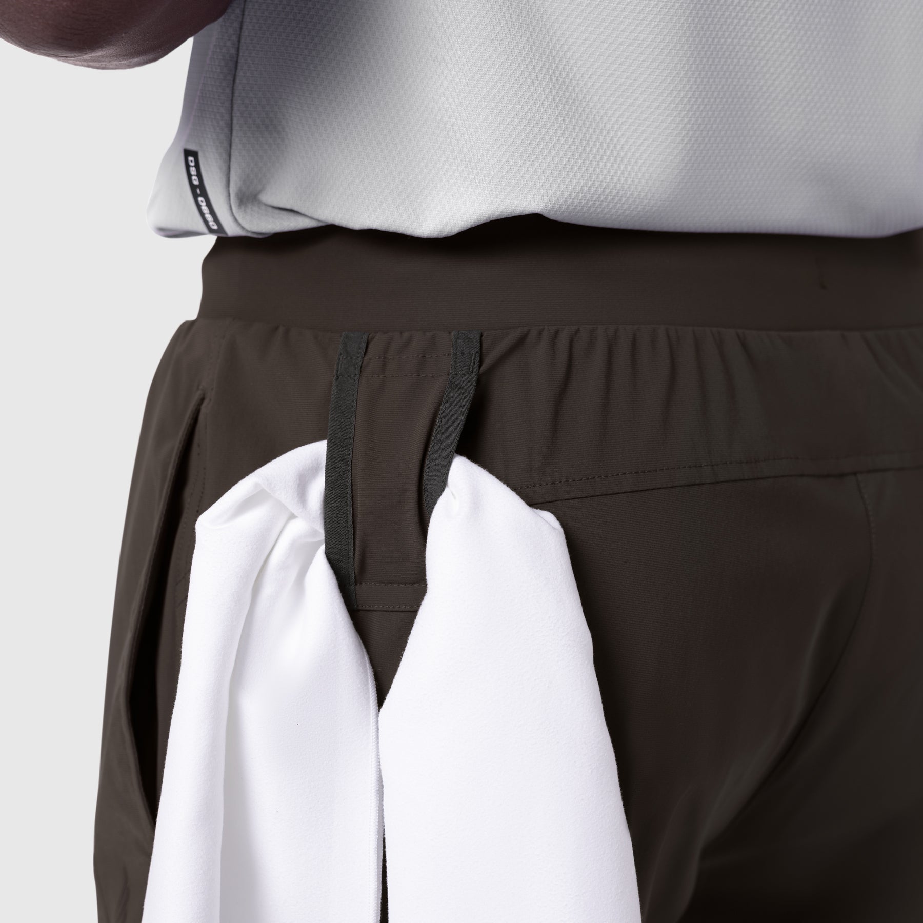Tetra-Lite Cargo High Rib Jogger in Dark Earth, worn with white shirt, detail view