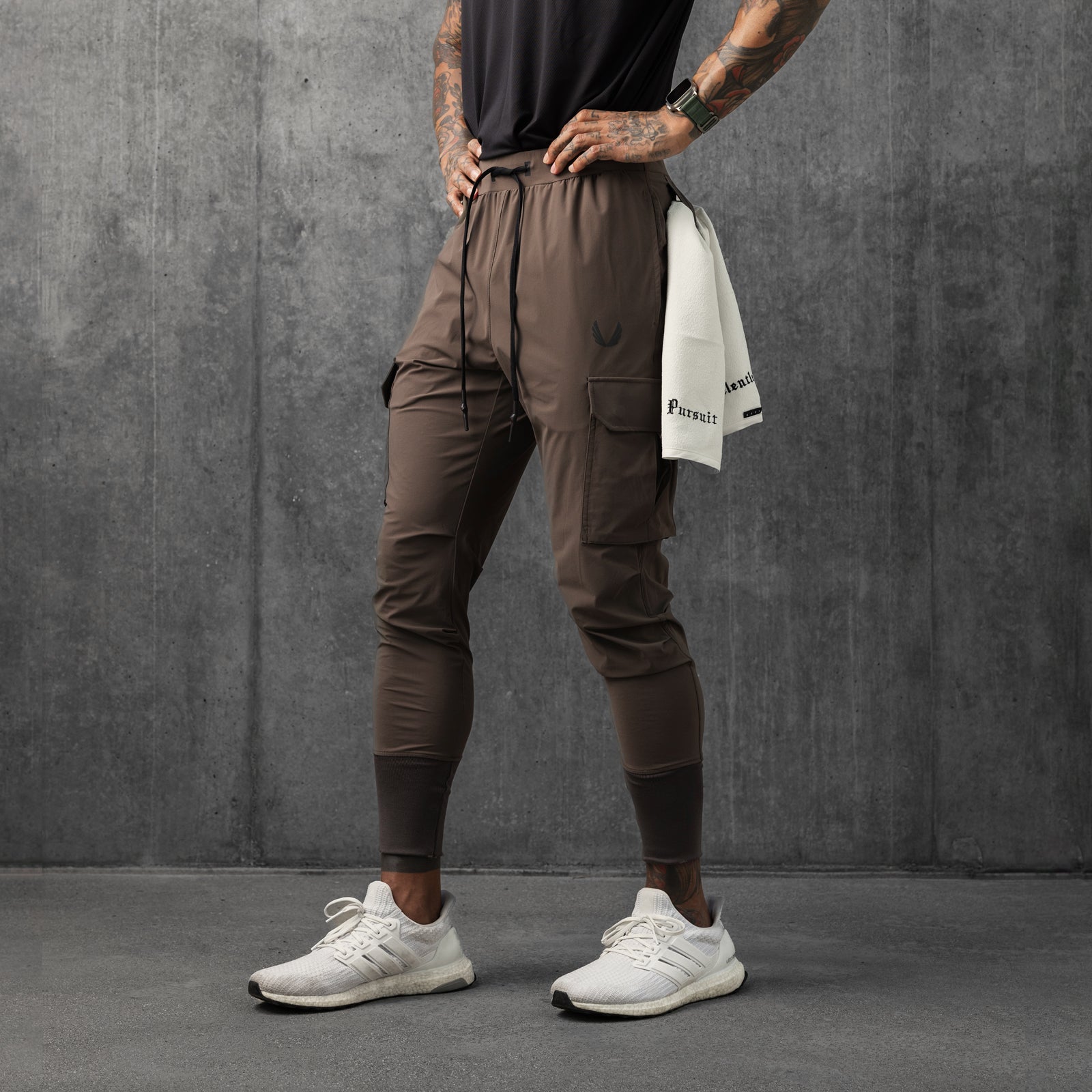 Tetra-Lite® Cargo High Rib Jogger in deep taupe, worn by model standing against gray wall