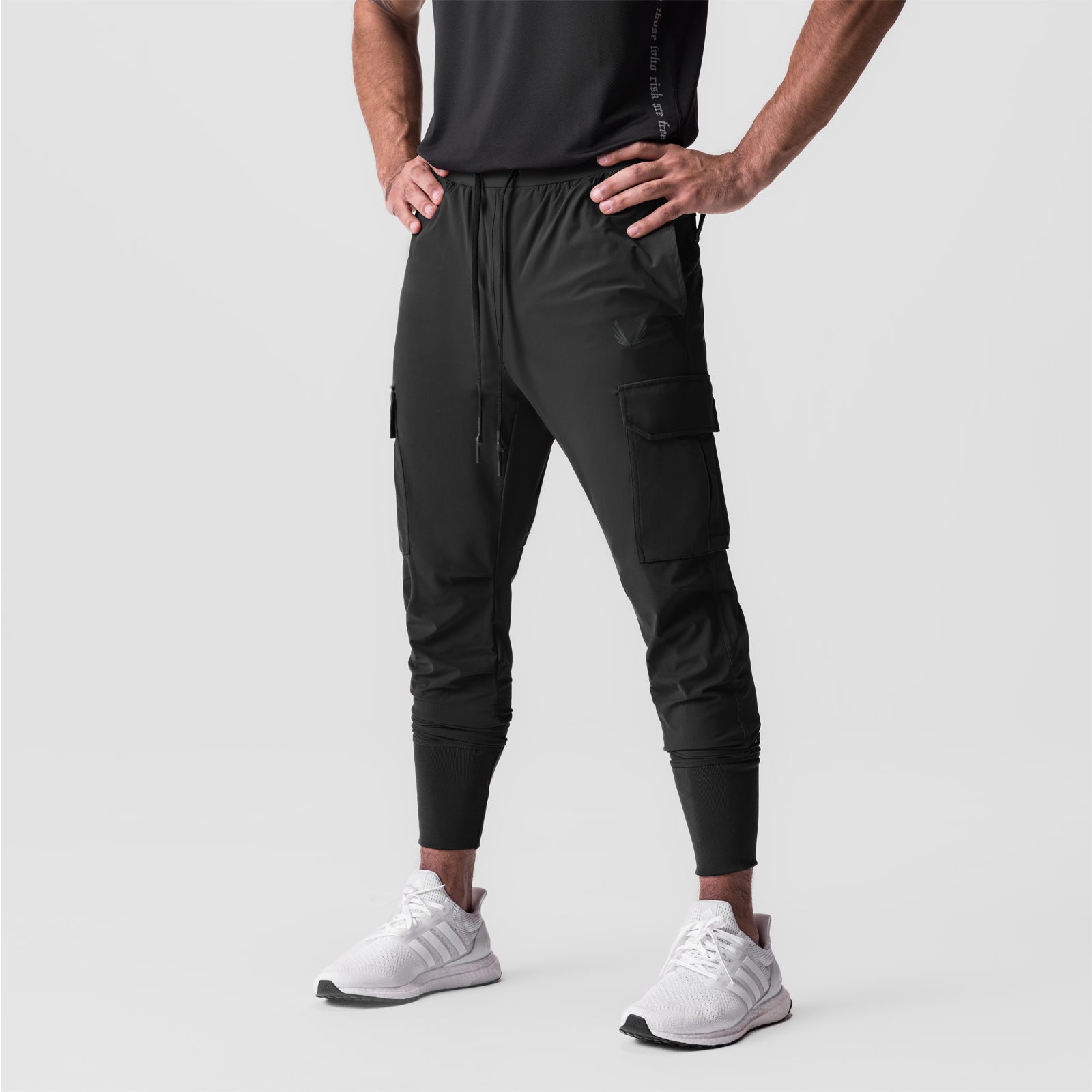 Tetra-Lite® Cargo High Rib Jogger in black, modeled from waist down with white sneakers