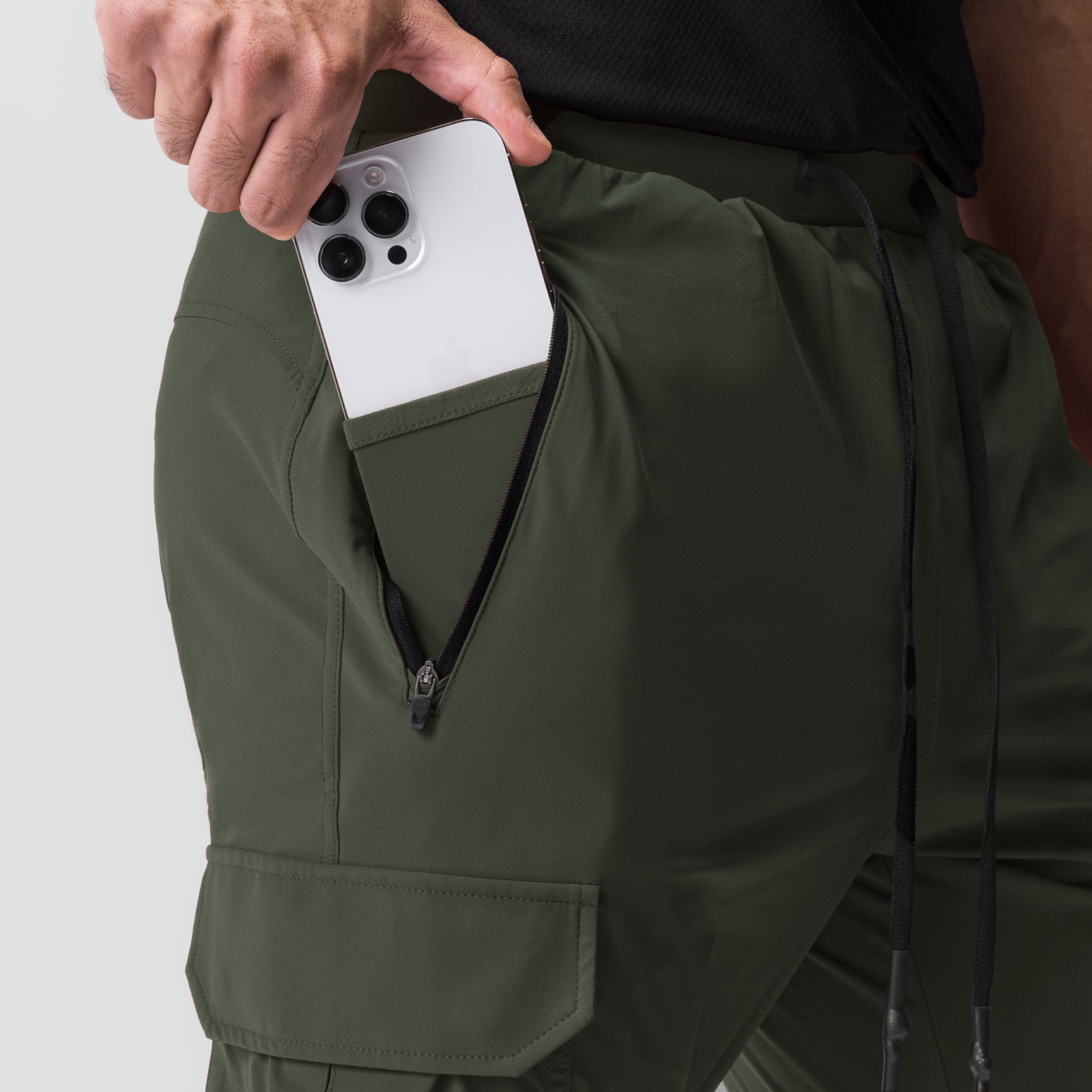 Tetra-Lite Cargo jogger in olive worn by model, showing phone pocket detail