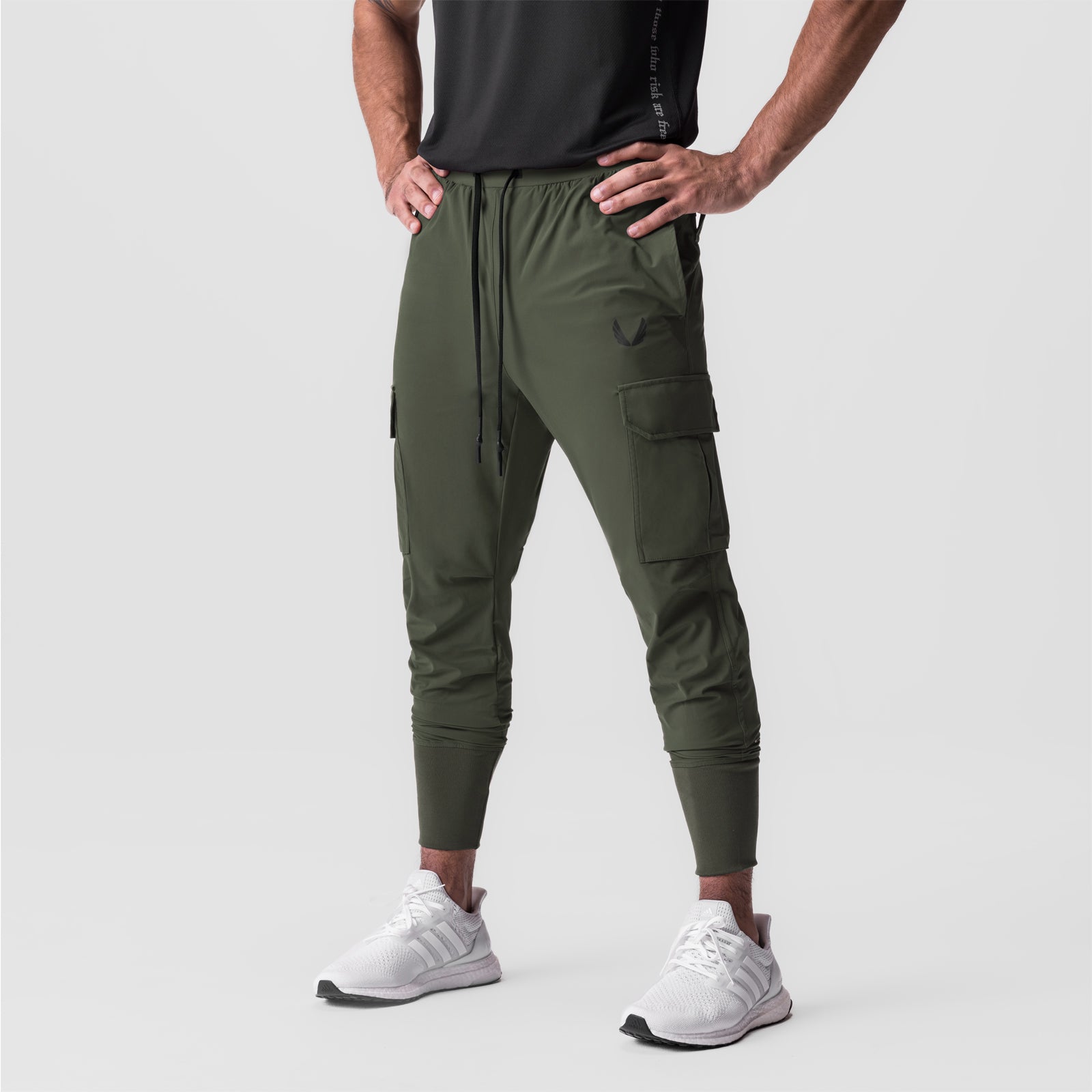 Tetra-Lite Cargo High Rib Jogger in olive, worn by model standing against white background